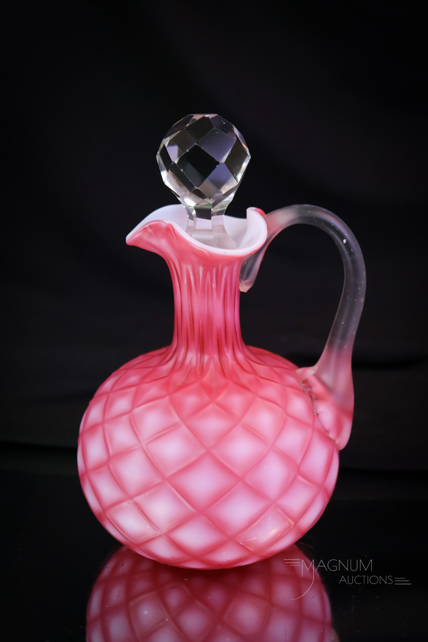 Phoenix Victorian Cut Velvet Art Glass Cruet: A pretty in pink cut velvet Victorian glass cruet. This cruet is attributed to Phoenix glass. This fine example has deep pink coloring and disctinct diamond quilt pattern. The cruet measures 5 3/4" ta