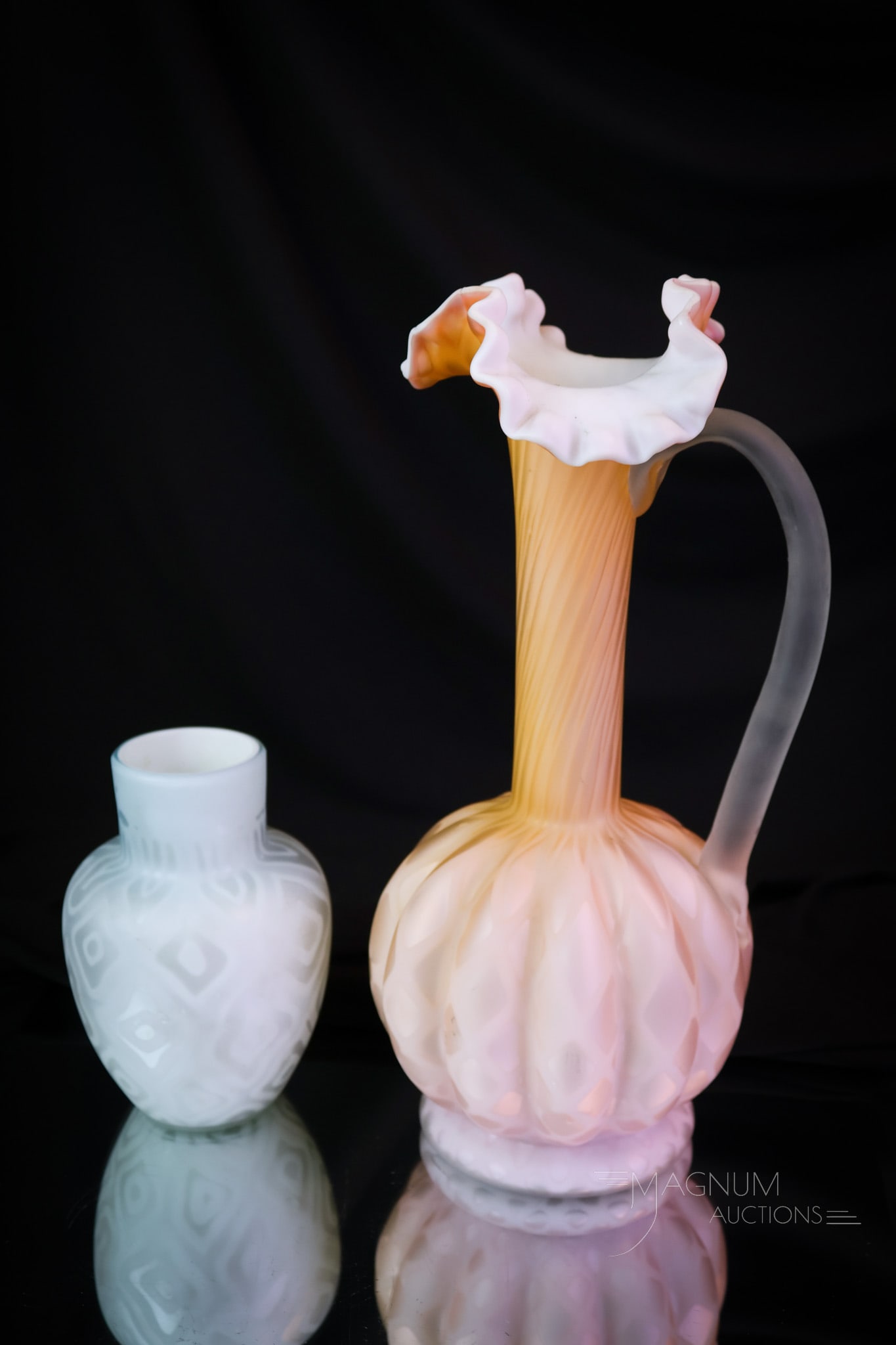 2 pc Lot Victorian Mother of Pearl Satin Art Glass: Two finds in Victorian mother-of-pearl satin glass. The first is a ewer in orange with a diamond-quilt pattern. The second is a Moiré pattern blue vase. The tallest measures 11 1/2". The blue Moire'