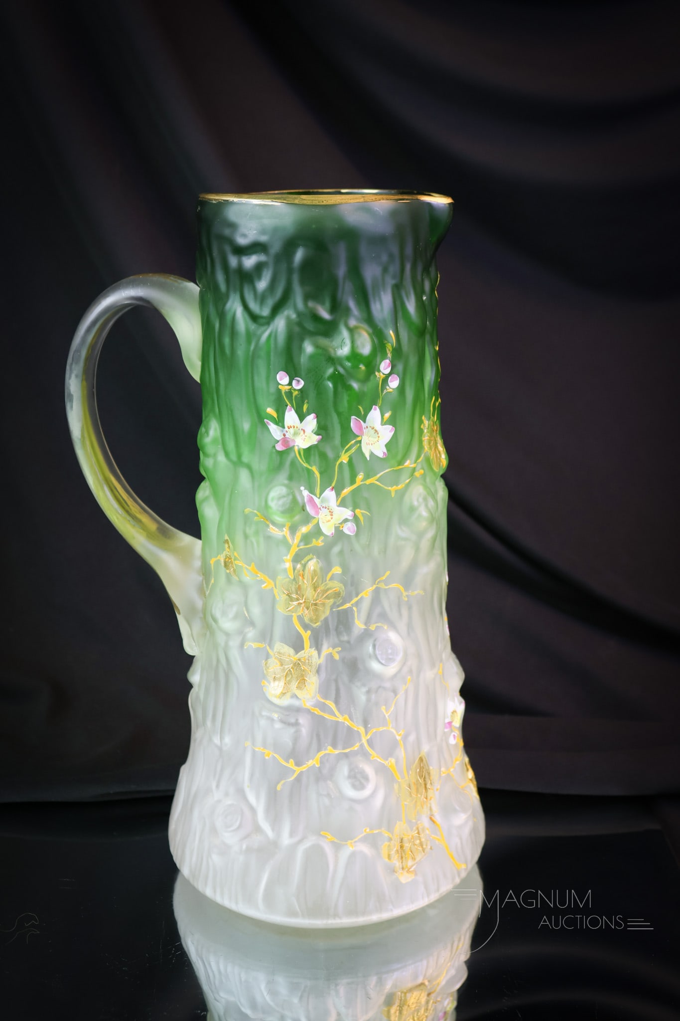 Rare Victorian Tree Trunk Art Glass Enameled Water Pitcher: A rare find in a Victorian art glss enameled water pitcher. This is a tree trunk-form pitcher. The glass is die-away green to clear with a frosted finish. It is decorated with florals. The pitcher mea