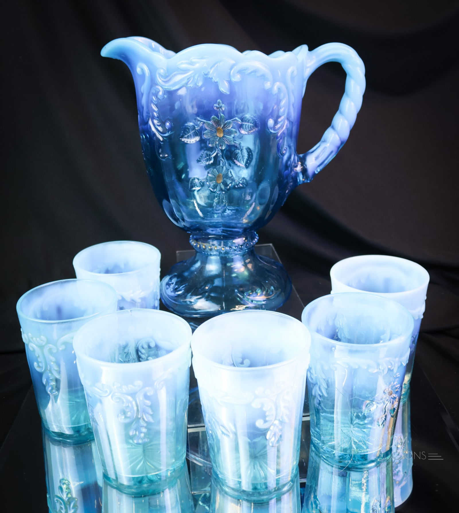 7 pc Northwood Blue Opalescent Inverted Fan & Feather Victorian Water Set: A beautiful Northwood blue opalescent Inverted Fan & Feather gilt decorated seven-piece water set. This set features a pitcher and six tumblers. The tallest measures 8 1/2". Chips are noted on the fee