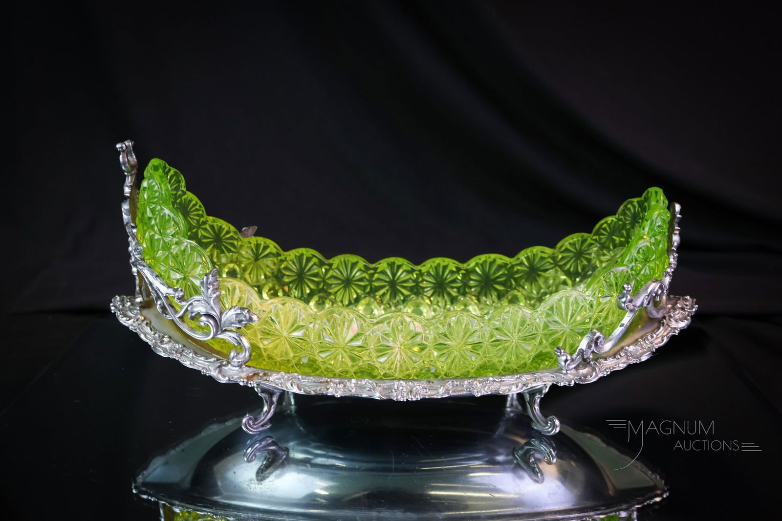 Vaseline Hobbs Victorian Glass Homan Silverplate Canoe Castor: A beautiful find in our auction! This is a Hobbs vaseline canoe castor. The vaseline glass canoe insert resides in a signed Homan silverplate ornate holder. Vasies stand up and take note of this fine