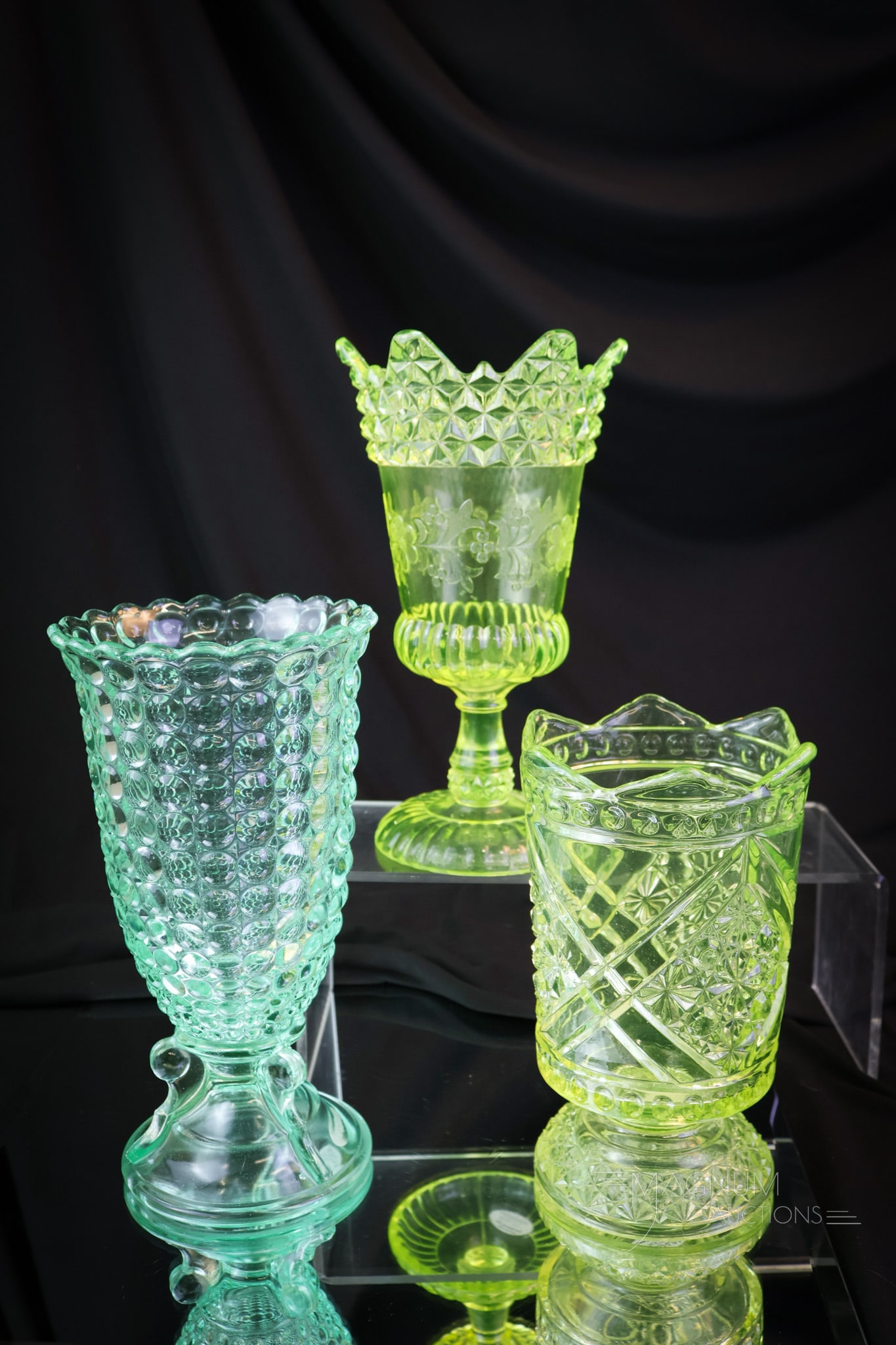 3 pc Lot Uranium Vaseline Glass Victorian Celery Vases: Three select examples of Victorian celery vases that glow under black light. Each of these is rich in uranium content. The first is a Vaseline Wildflower pattern. The second is a vaseline Daisy & Butt