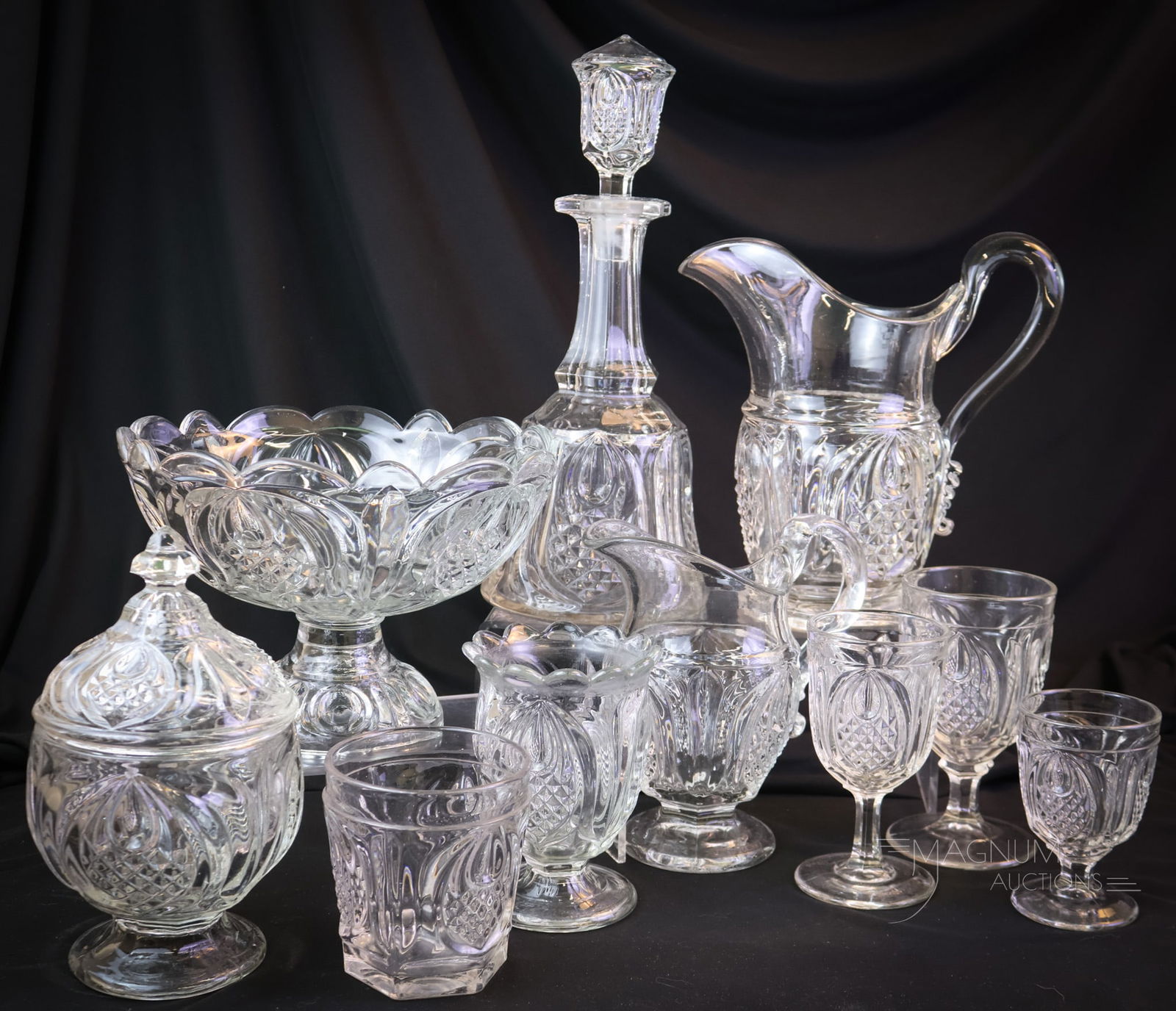 10 pc Lot Victorian Flint Glass Boston Sandwich & More: Ten desirable finds in Victorian flint glass. This offering includes the New England Pineapple pattern made by Boston & Sandwich and other makers. This lot consists of a decanter, a water pitcher, thr