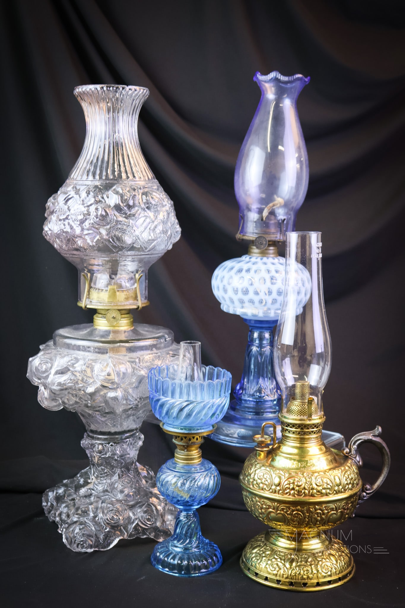 4 pc Lot Victorian Oil Lamps Opalescent & More: Four nice finds in Victorian oil lamps. This lot includes select examples of everything you have dreamed of in Victorian oil lighting. There is a Miller brass finger lamp. A clear blown-out Roses stan