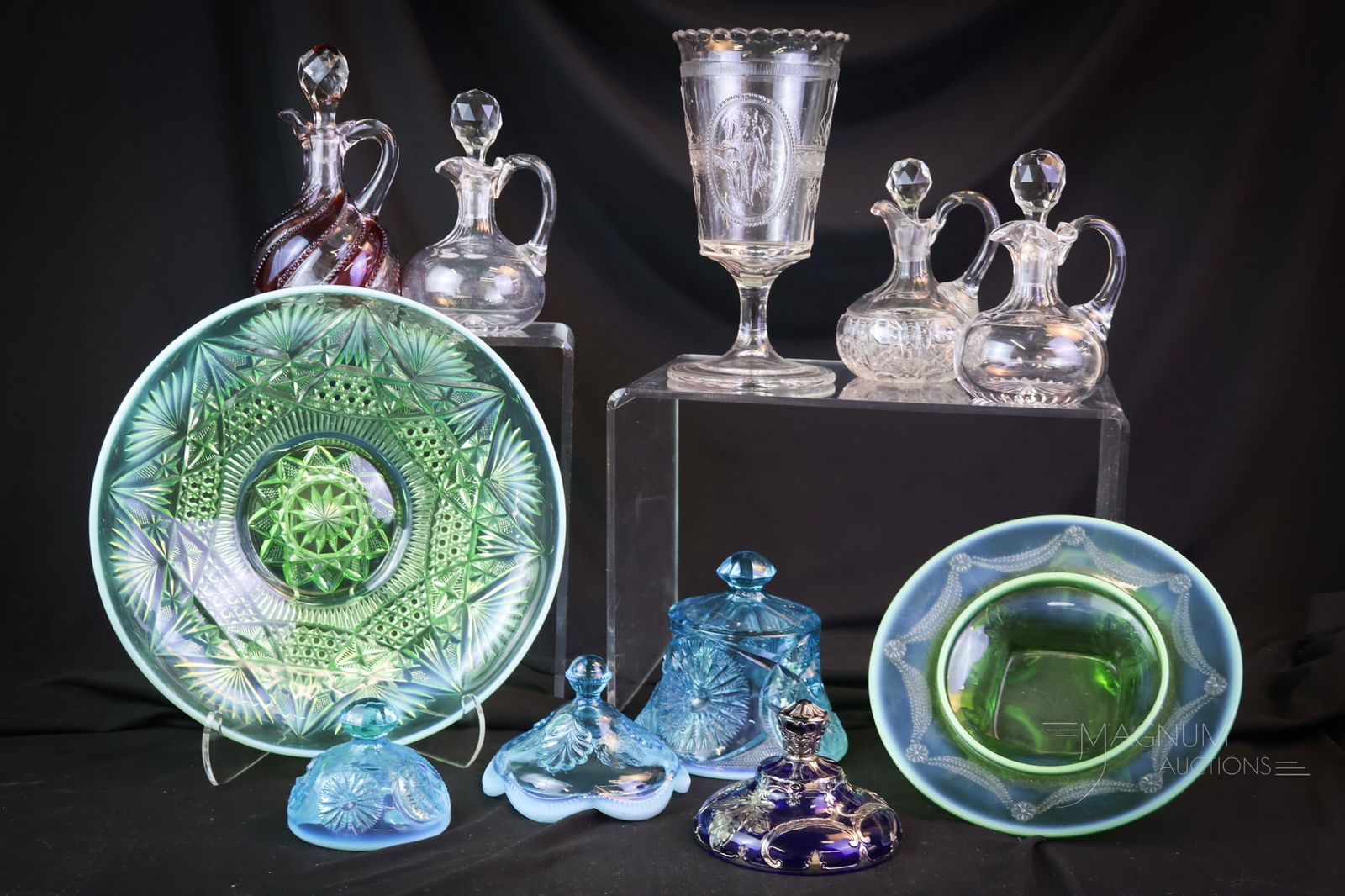 11 pc Lot Collectible Glass Opalescent & More: Eleven examples of things you didn't know you could live without. This lot includes a Cupid & Psyche celery vase. A green opalescent bowl. Four cruets. Five parts for Butter or sugar bowls. The