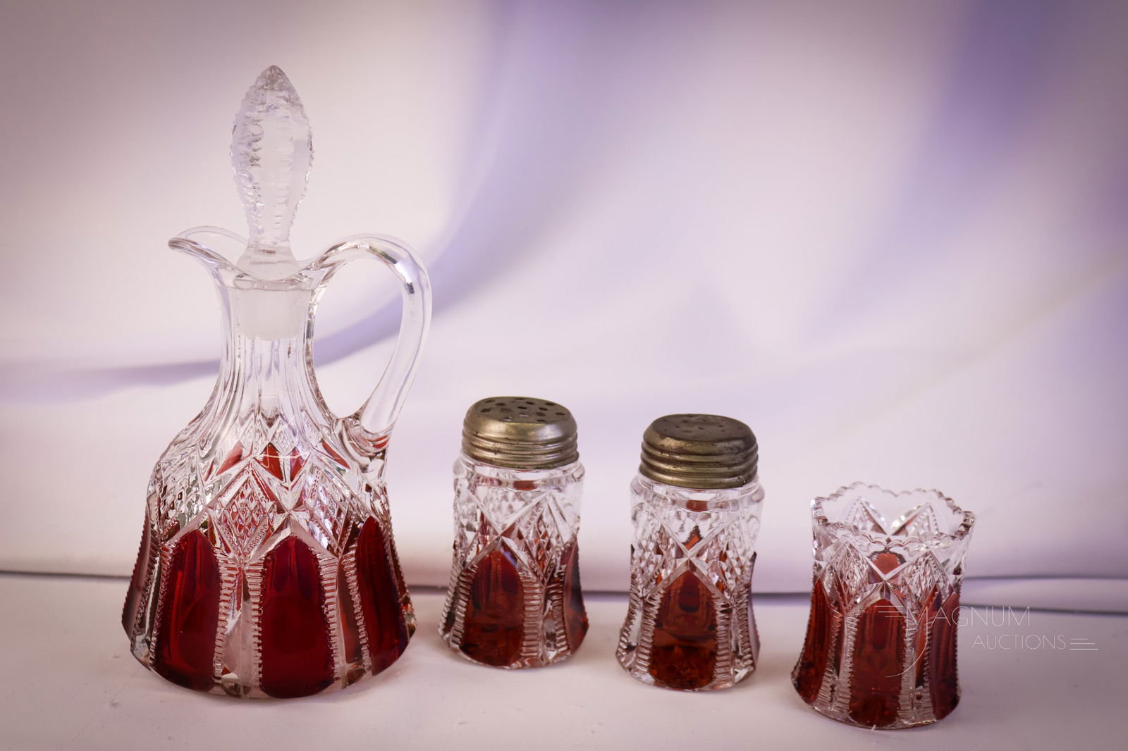 4 pc Lot Ruby Stained Tarentum Ladder & Diamonds Cruet Shakers, Toothpick Holder: Four selections in ruby-stained Victorian glass that are just plain nice. This lot offers a cruet, shakers, and a toothpick holder. The tallest measures 7 1/4". SHIPPING NOTICE: If you choose not to u