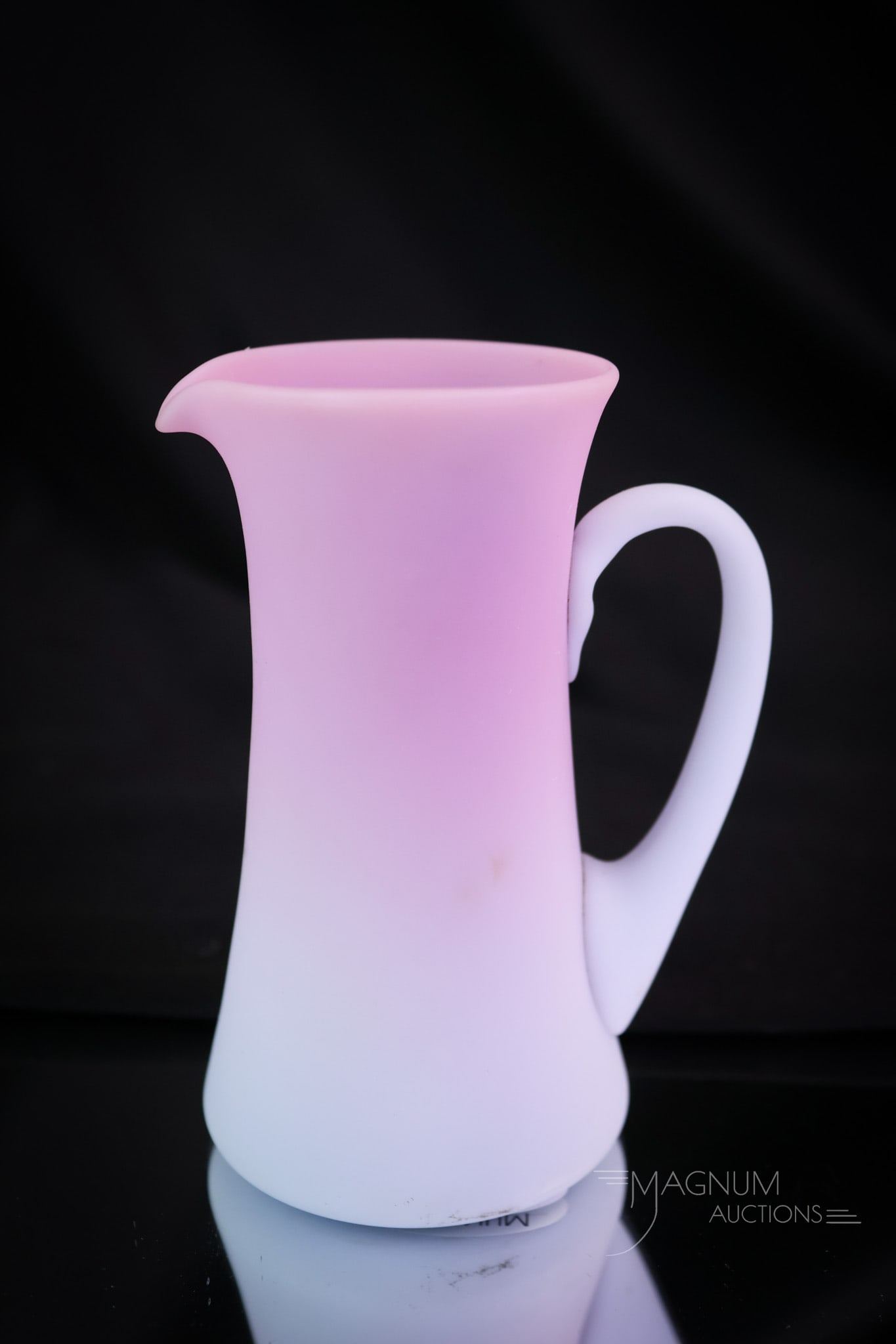 Mt. Washington Peachblow Satin Glass Cream Pitcher: A rare find in a Mt. Washington Peachblow satin cream pitcher. This piece has exceptional coloring and a sleek form. Surely you'll want this for your collection! This pitcher measures 3 1/2" tall and 