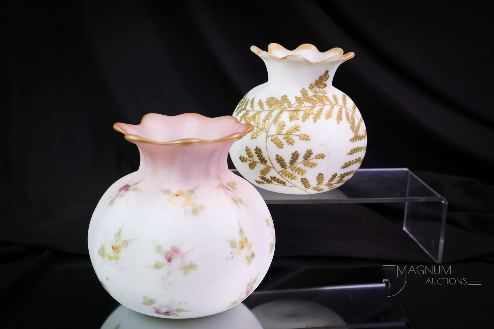 Pair of Mt. Washington Crown Milano Art Glass Vases: A select offering of two Mt. Washington Crown Milano art glass vases. Both in the same mold. The larger is decorated with a rose spray. The smaller vase is decorated with gold trailing vines. The tall