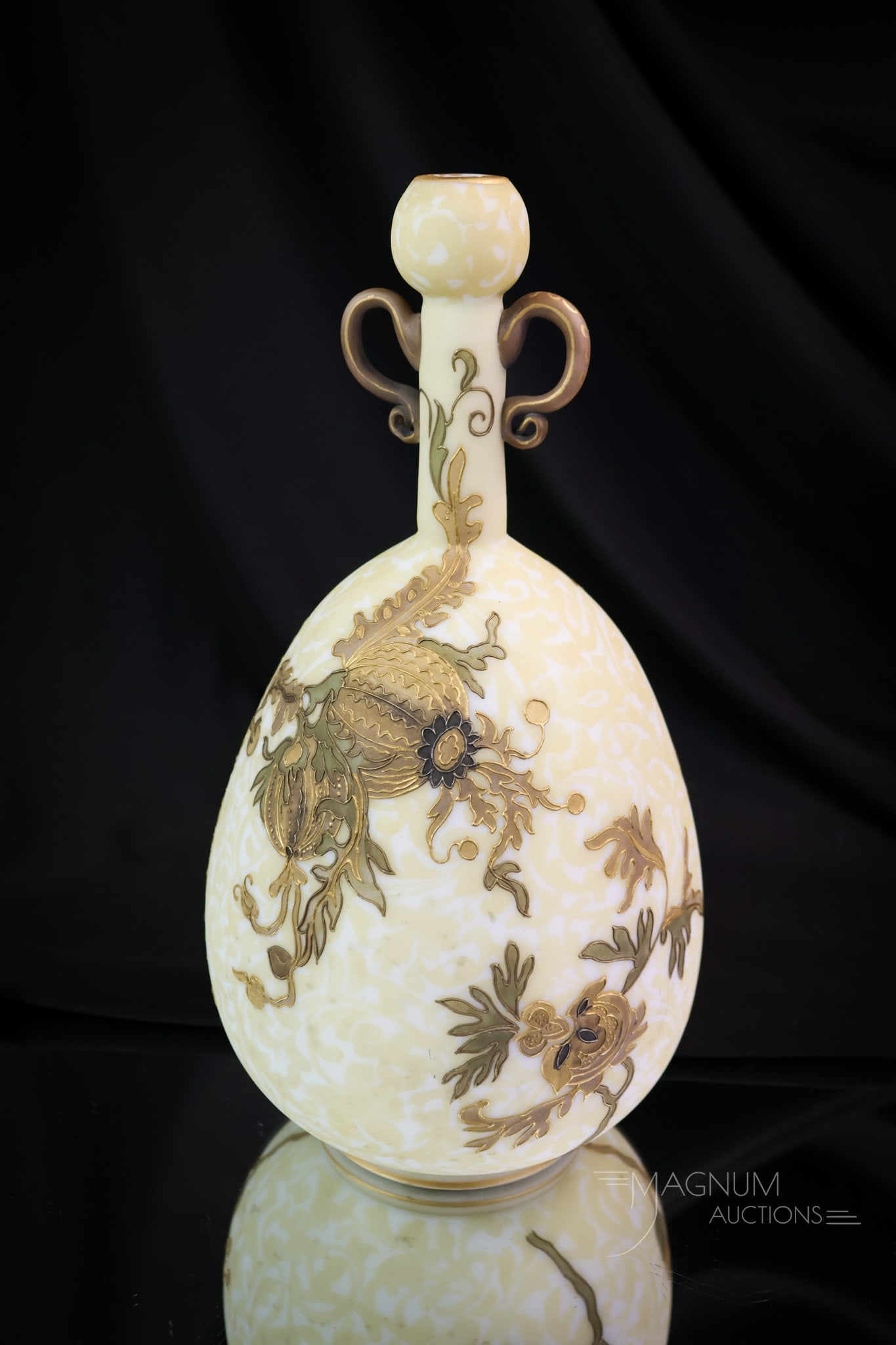 Mt. Washington Crown Milano Victorian Art Glass Vase: An amazing find in Mt. Washington art glass. This piece is in the Crown Milano line. It features double-applied handles and an intricate, stylized floral decoration. The vase measures 10" tall and 4 1
