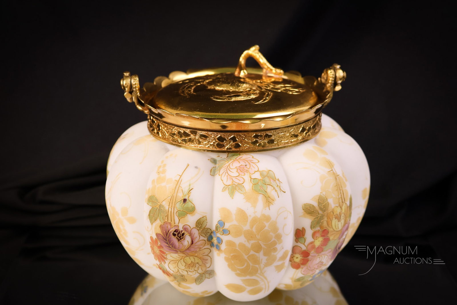 Mt. Washington Crown Milano Victorian Gilt Decorated Glass Biscuit Jar: A beautiful example of a Mt. Washington Crown Milano Victorian biscuit jar. This jar features a lovely floral decoration. A gold-plated lid and bail complete the jar. The lid is embossed with a repous
