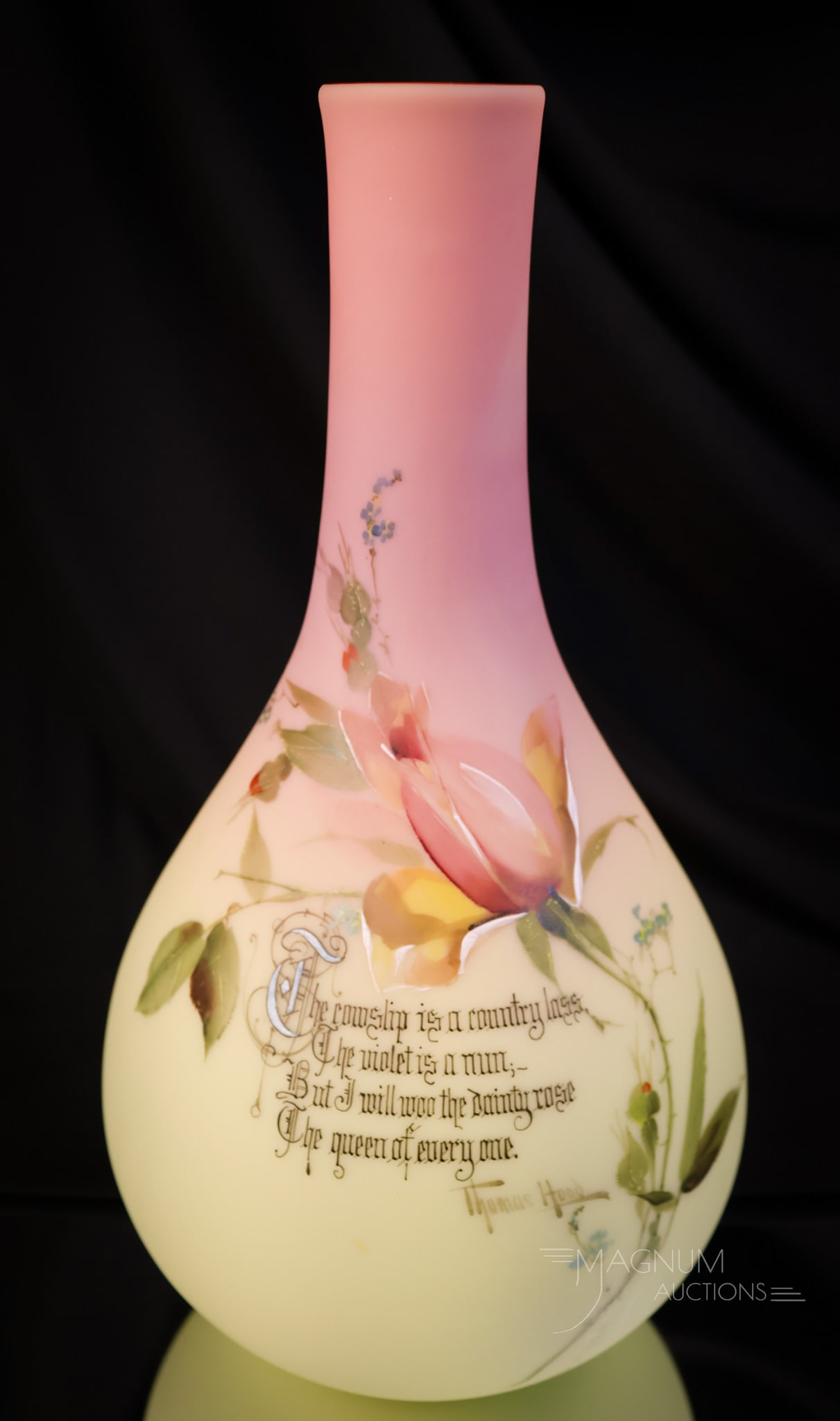 Mt. Washington Burmese Glass Thomas Hood Verse Floral Decorated Vase: A fine example of a perfect Mt. Washington burmese glass vase. This piece has excellent coloring and has additional decoration of a Thomas Hood Verse and flowers. The vase measures 12"tall and 6" wide