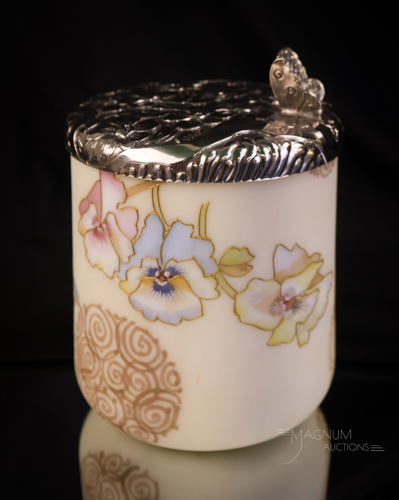 Mt. Washington Crown Milano Art Glass Pansy Decorated Humidor: A wonderful find in a Mt. Washington Crown Milano art glass humidor. The glass is decorated with a plethora of pansy flowers. The silverplate lid is marked "M.W." and features a butterfly on top and a