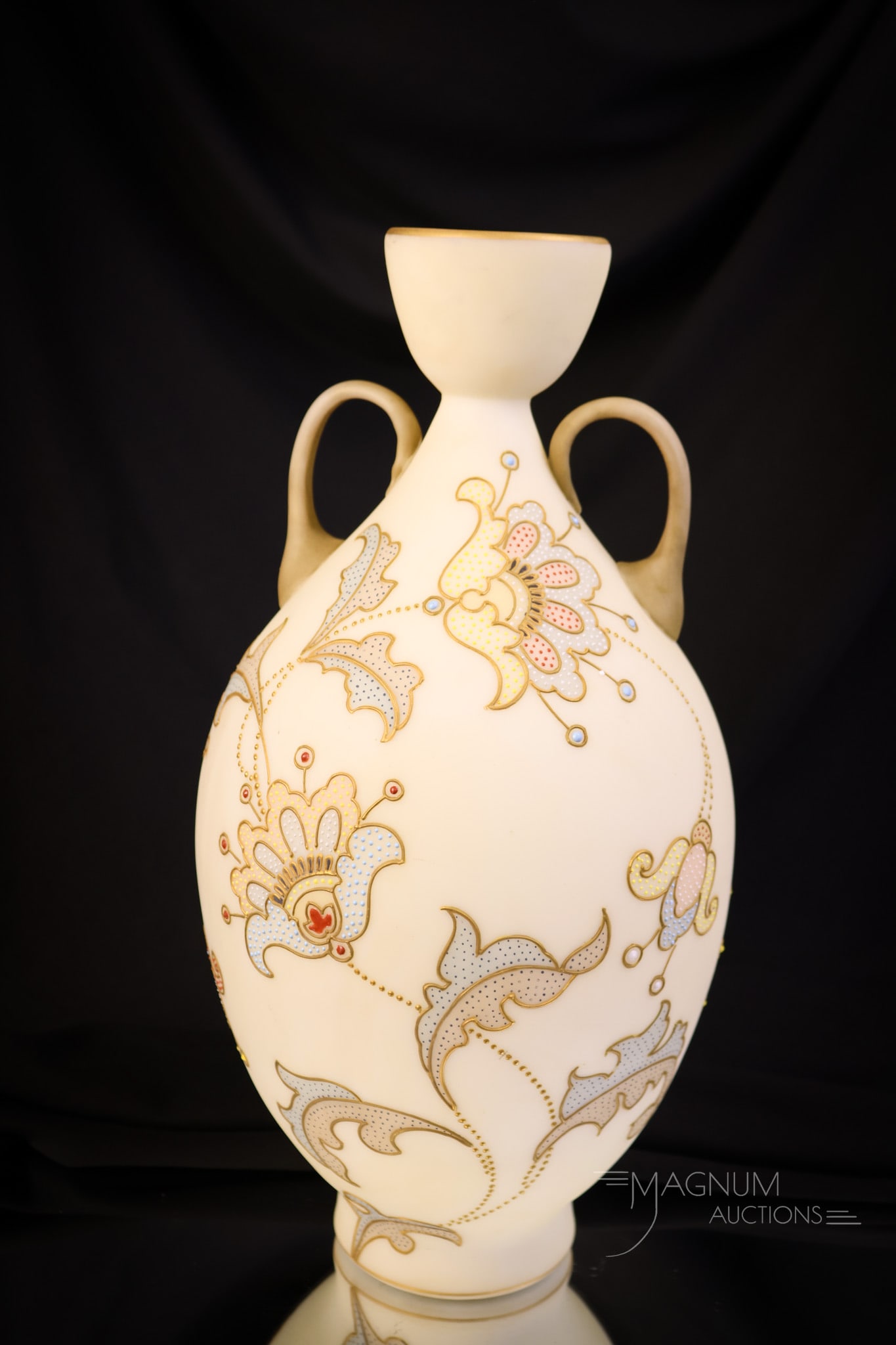 12" Mt. Washington Crown Milano Victorian Art Glass Petit Point Handled Vase: A gorgeous find in a marked piece of Mt.Washington in their Crown Milano line. This vase retains the original paper label. The vase measures 12" tall and 5 3/4" wide. It has a decoration of stylized f
