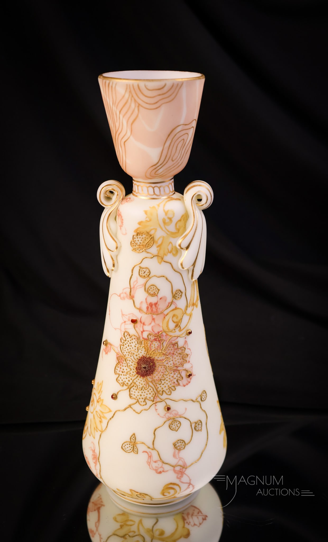 Mt. Washington Crown Milano Applied Cabochon Victorian Glass Vase: A wonderful find in Mt. Washington Crown Milano glass. This vase measures 9 1/4" tall and 3 1/4" wide. The vase features an egg cup top form with applied scrolling handles and all-over floral decorati
