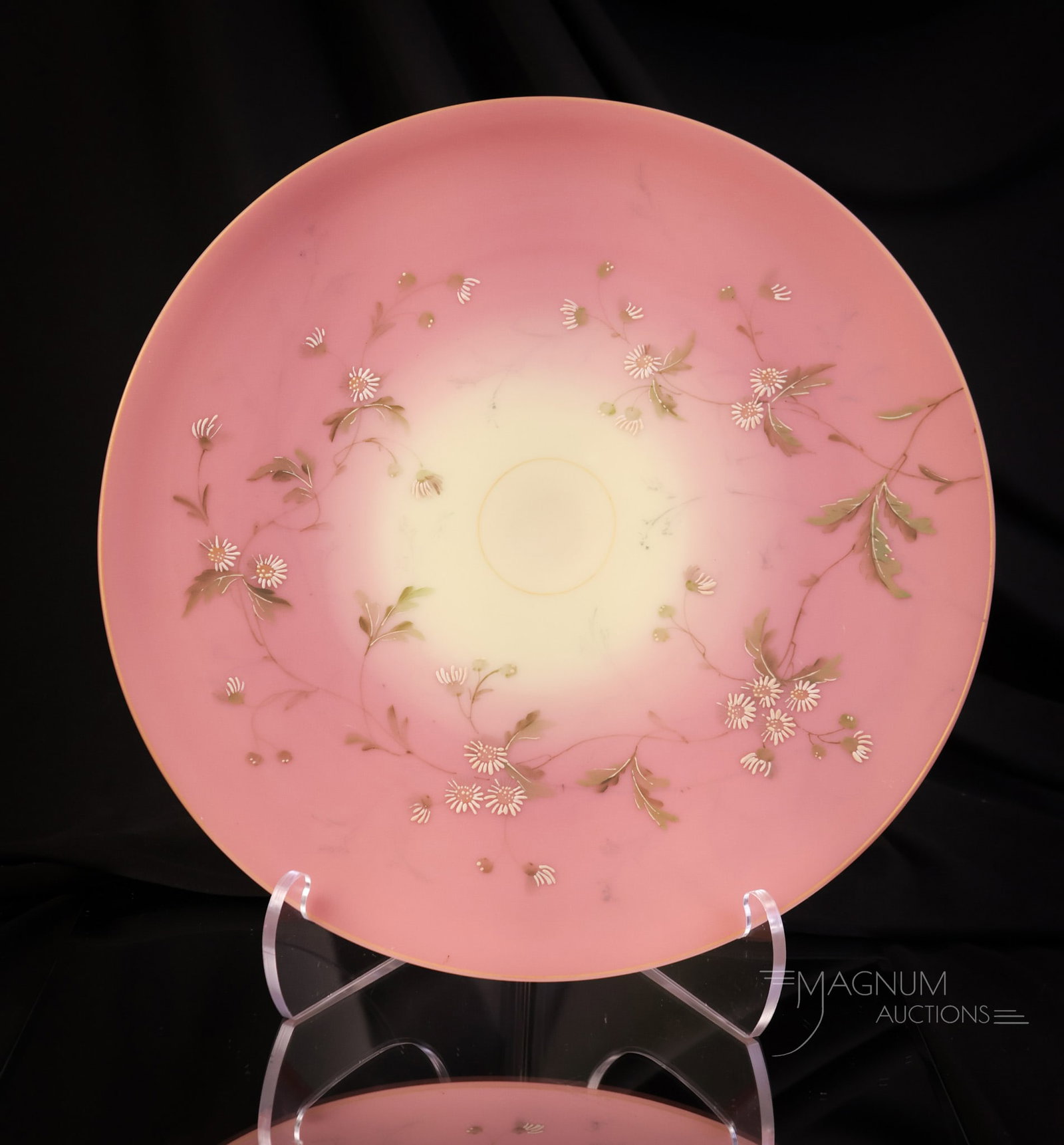 Mt. Washington Burmese Decorated Glass 12 1/4" Charger: A gorgeous and rarely found Mt. Washington burmese glass charger with factory decoration of daisy flowers and foliage and gold trim. This piece measures 1 1/2" tall and 12 1/4" in diameter. SHIPPING N