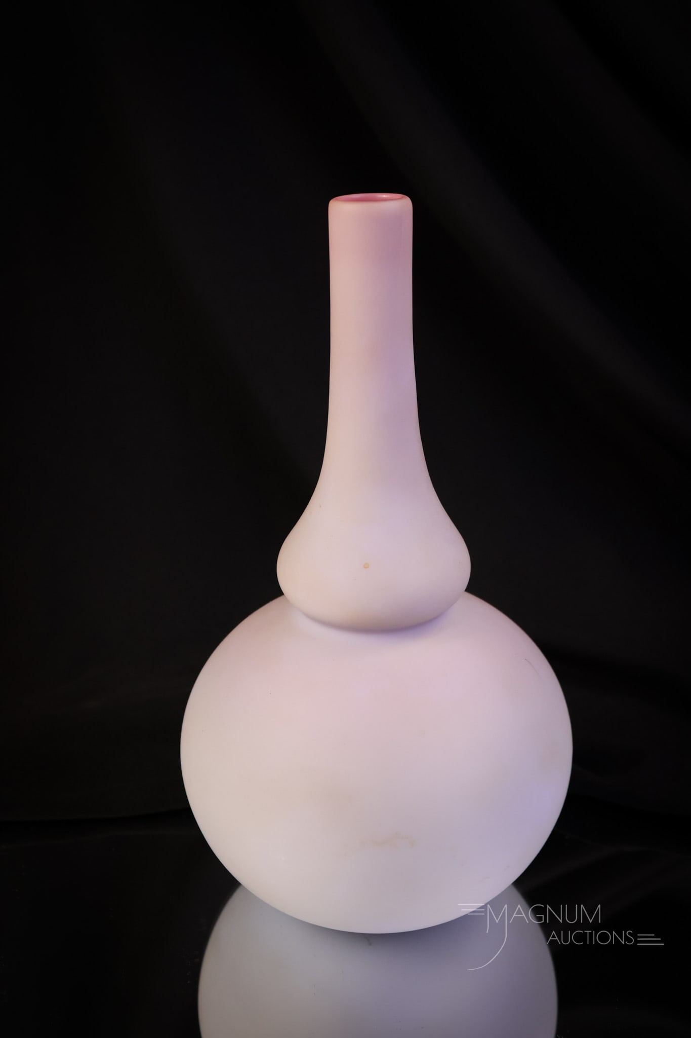 Mt. Washington Art Glass Peachblow 8 1/2" Vase: A very unusual find in Mt. Washington peachblow art glass. This one has subtle coloring and a graceful form. The vase measures 8 1/2" tall and 4 1/2" wide. SHIPPING NOTICE: If you choose not to