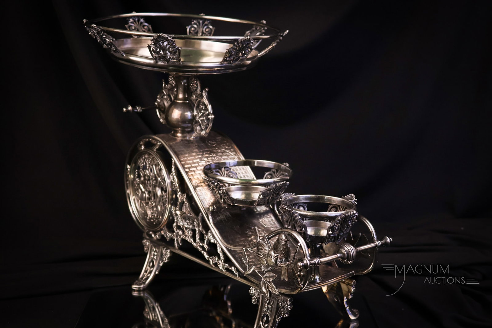 Meriden Victorian Silverplate Berry Set Holder: A rare holder you'll have to admit. This one is by Meriden silverplate. It is a holder for a Master berry bowl, a creamer, and a sugar bowl. This ornate holder is in excellent condition with very orna
