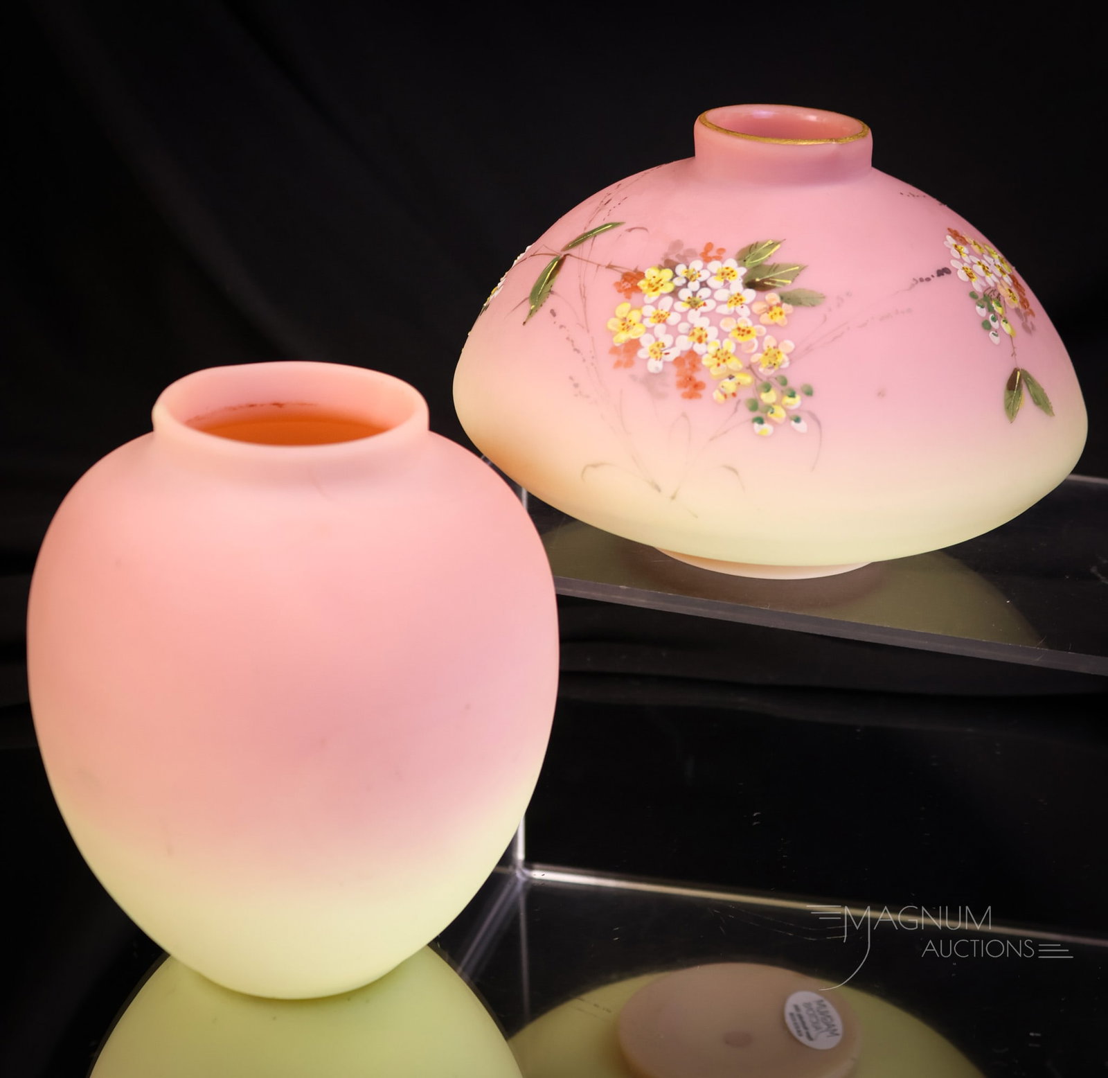 2 pc Mt. Washington Victorian Burmese Glass Decorated & More: Two lovely examples of Mt. Washington Victorian burmese glass. The first is a temple jar without a lid. This has floral decoration. The second is an undecorated jar-form vase. The tallest measures 4 1