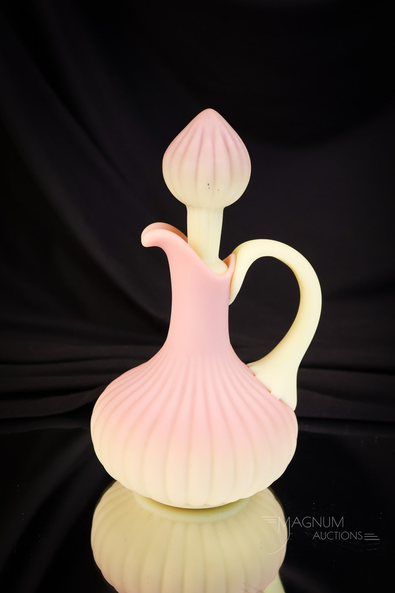 Mt. Washington Victorian Burmese Glass Ribbed Cruet: A wonderful Mt. Washington glass burmese cruet. This one has a ribbed body and a matching stopper. The piece has excellent coloring. The cruet measures 6 1/4" tall. SHIPPING NOTICE: If you choose not 