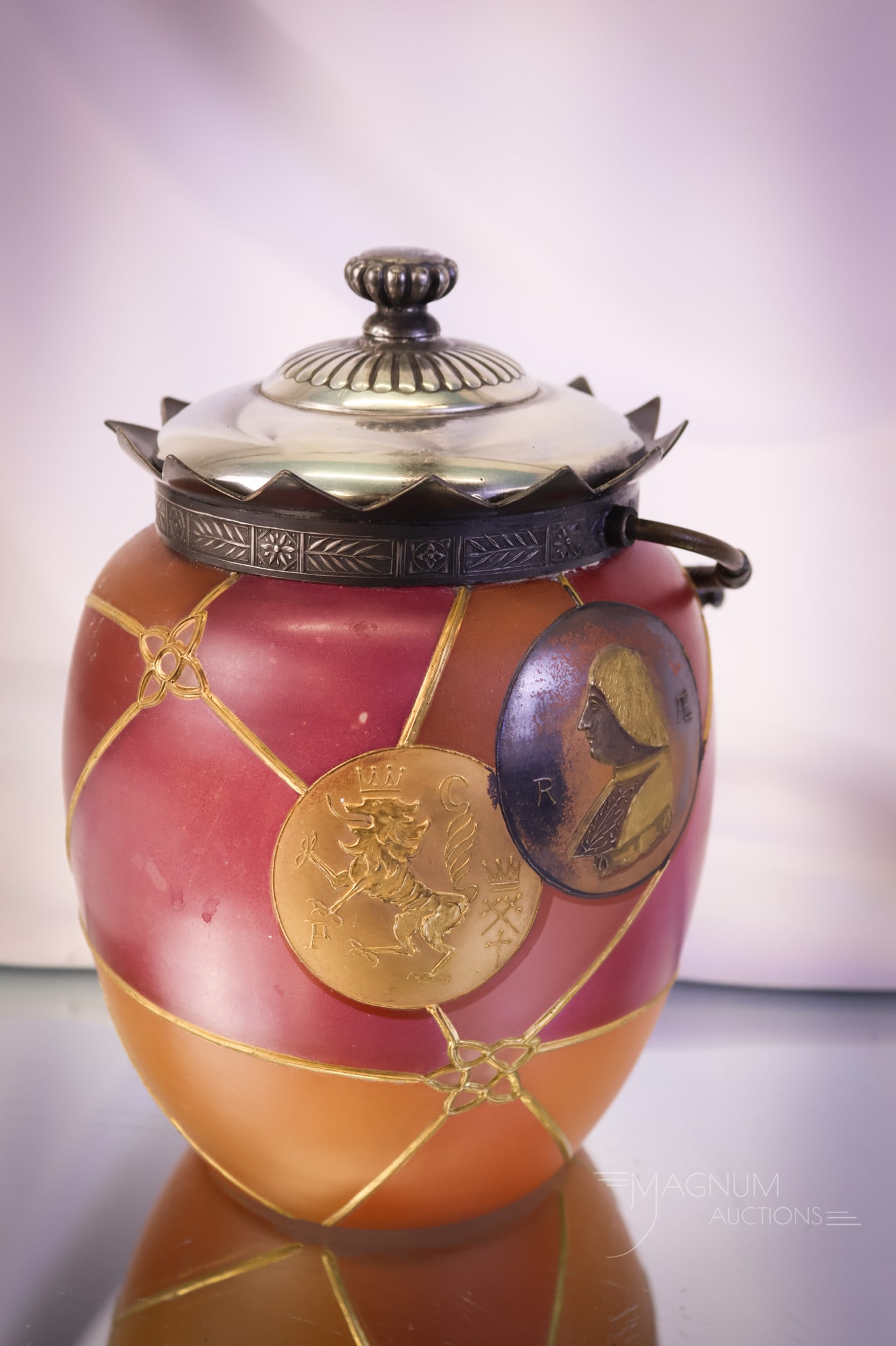 Mt. Washington Royal Flemish Victorian Glass Biscuit Jar: A fine example of a Mt. Washington Victorian Glass Royal Flemish line biscuit jar. This one is decorated with segmented panels, portrait coins, and a dragon adorned coin. The jar measures 8" tall. SHI