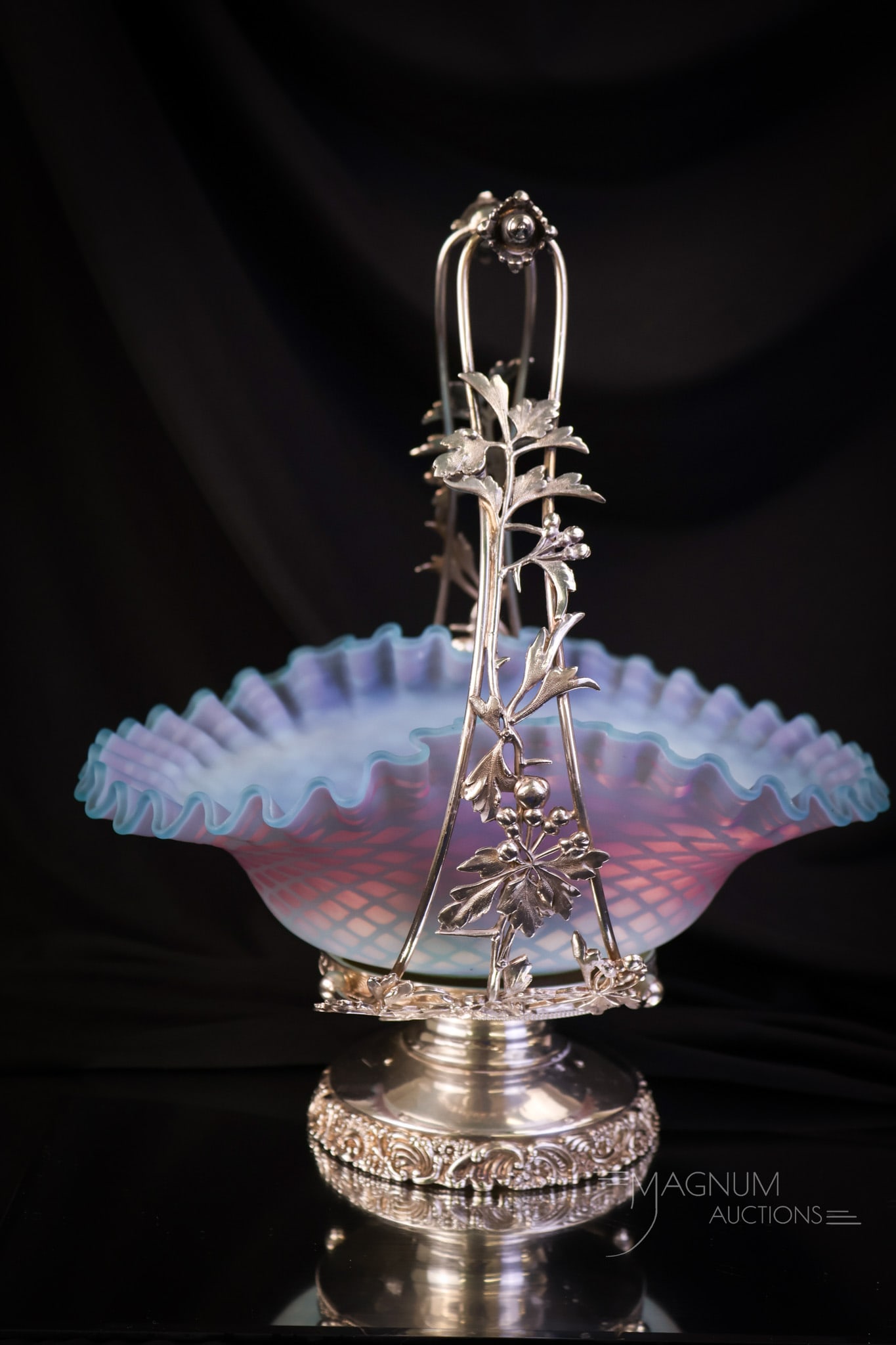 Victorian Bluerina Mother of Pearl Meriden Silverplate Brides Basket Centerpiece: A gorgeous find in a Victorian bluerina colored mother of pearl, satin glass brides bowl set in a signed Meriden silverplate frame. This lovely piece features extraordinary coloring of blue to purple,