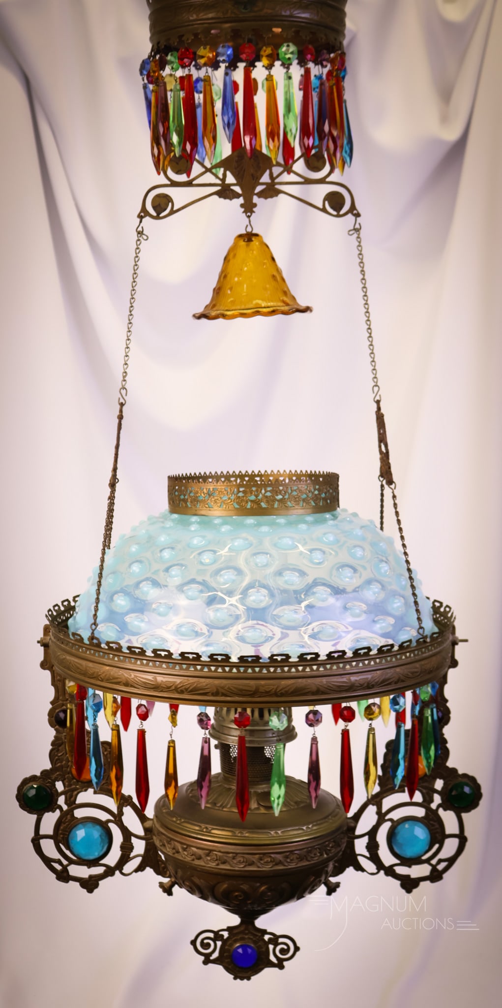 Victorian Jeweled Blue Opalescent Hanging Parlor Oil Lamp: A gorgeous jeweled frame hanging Victorian parlor oil lamp. This estate fresh piece is loaded with faceted jewels in various sizes and colorful prisms. The shade is an aqua blue opalescent hobnail exa