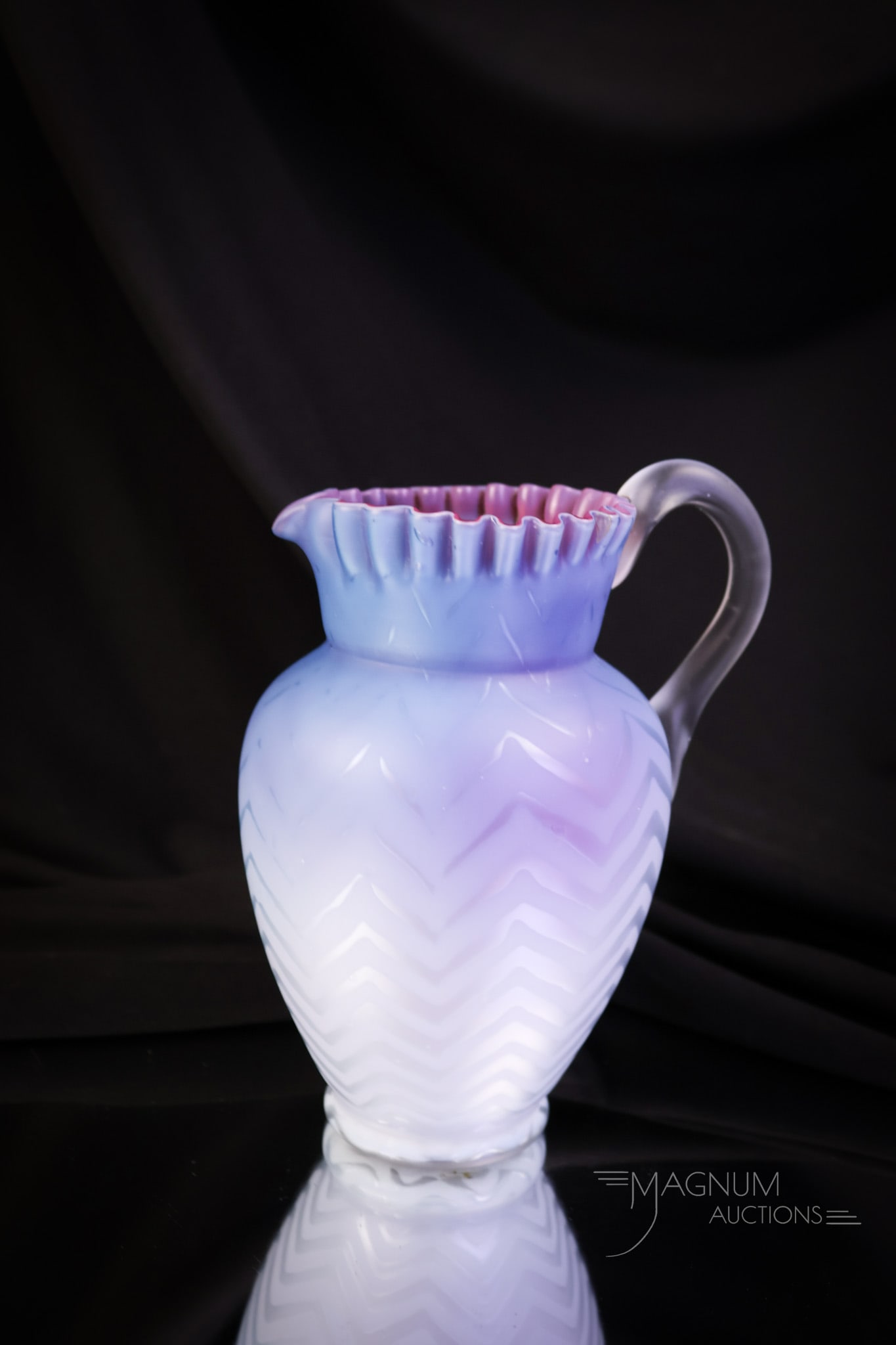 Blue Raspberry Victorian Mother of Pearl Satin Glass Herringbone Cream Pitcher: A beautiful find in mother-of-pearl satin glass. This is a cream pitcher in a blue raspberry. The exterior is a lovely delphinium blue, and the interior is a deep pink. The pattern of the glass is Her