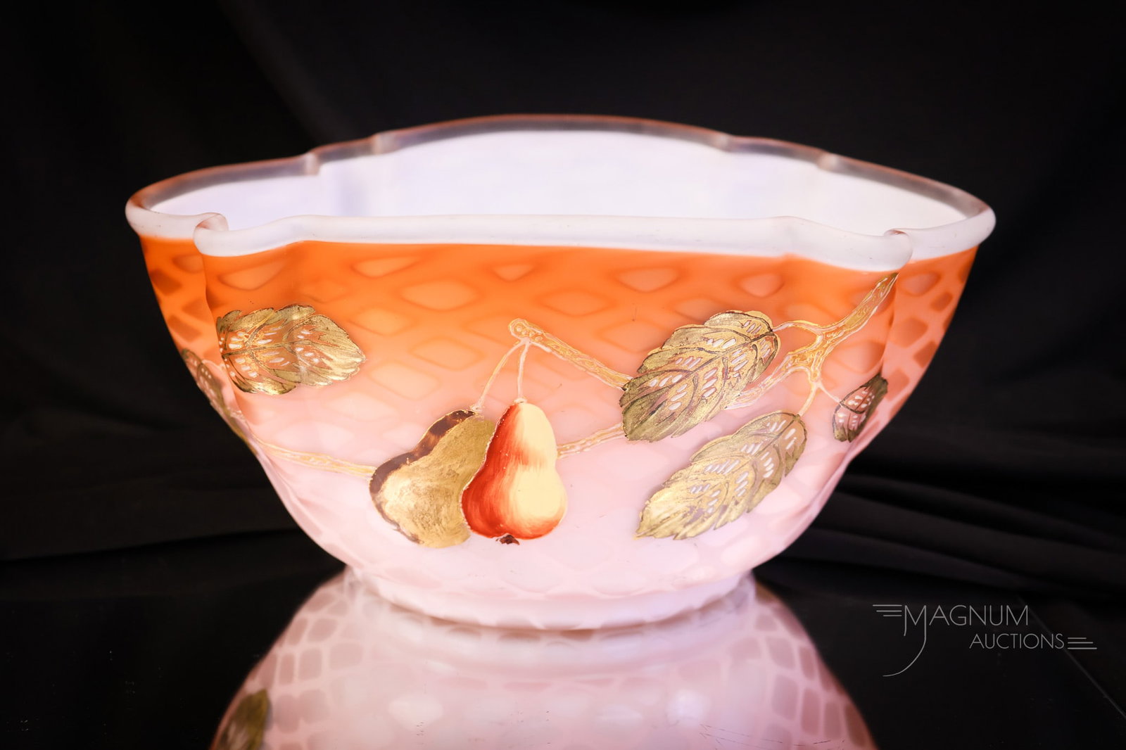 Victorian Mother of Pearl Salmon Orange Gilt Enameled Brides Bowl: A gorgeous find in an unusual coloring. This is a salmon/orange mother-of-pearl diamond-quilt, satin glass brides bowl. It is gilt and enamel decorated with pears and foliage. The bowl measures 4 1/2"