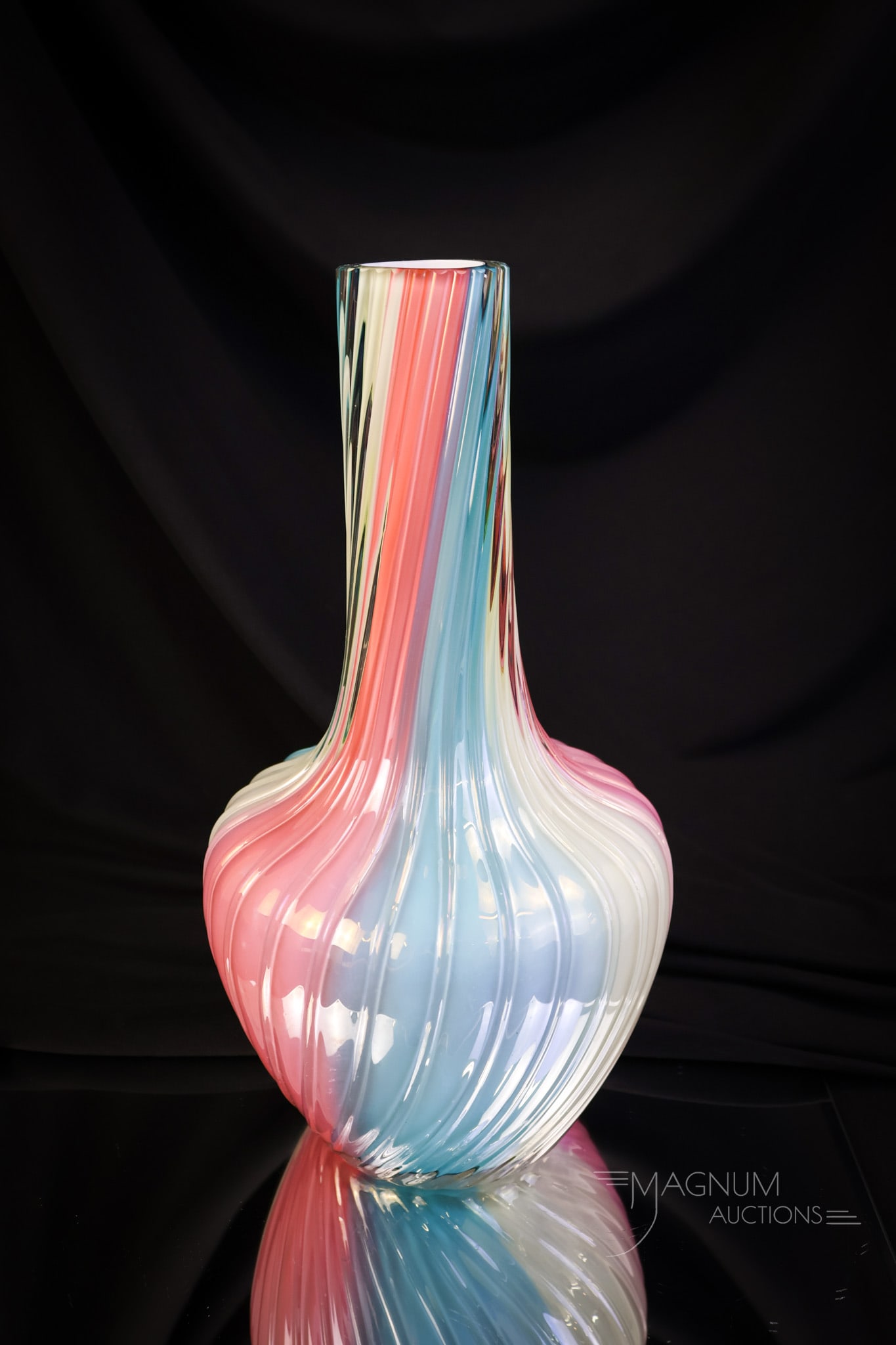 Loetz Cased Rainbow Swirl Uranium Victorian Glass Vase: A beautiful find in Loetz rainbow glass. This piece measures 11" tall and 5 1/2" wide. The vase is rich in uranium content and glows brightly under black light. SHIPPING NOTICE: If you choose not to u