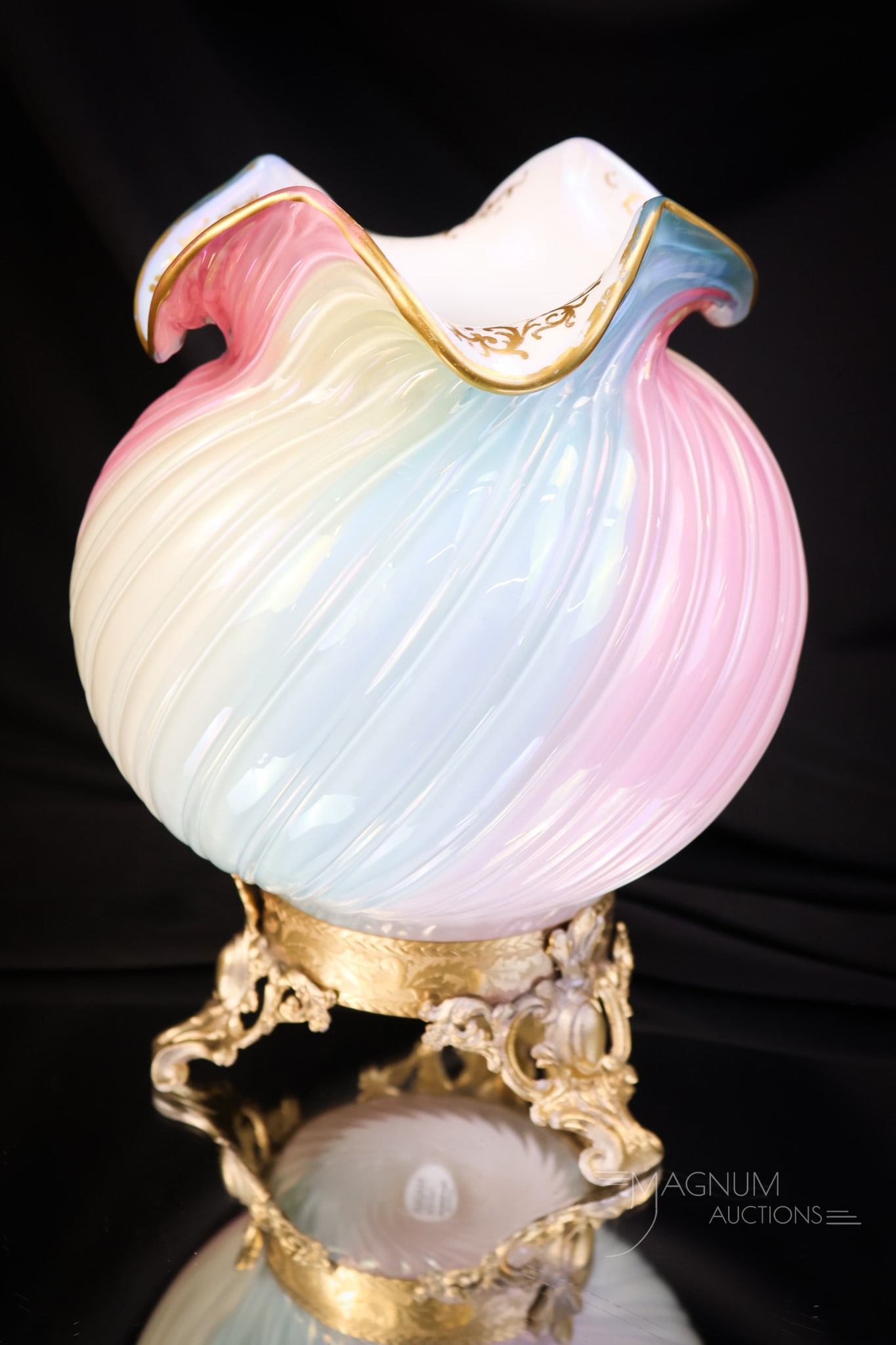 8 1/2" Loetz Rainbow Victorian Glass Uranium Ormolu Vase: A rare find in Victorian Loetz rainbow glass. This piece is a large 8 1/2" tall vase with applied ormolu trim and gilt decoration. This piece glows brightly with its uranium content. The vase is 6" wi