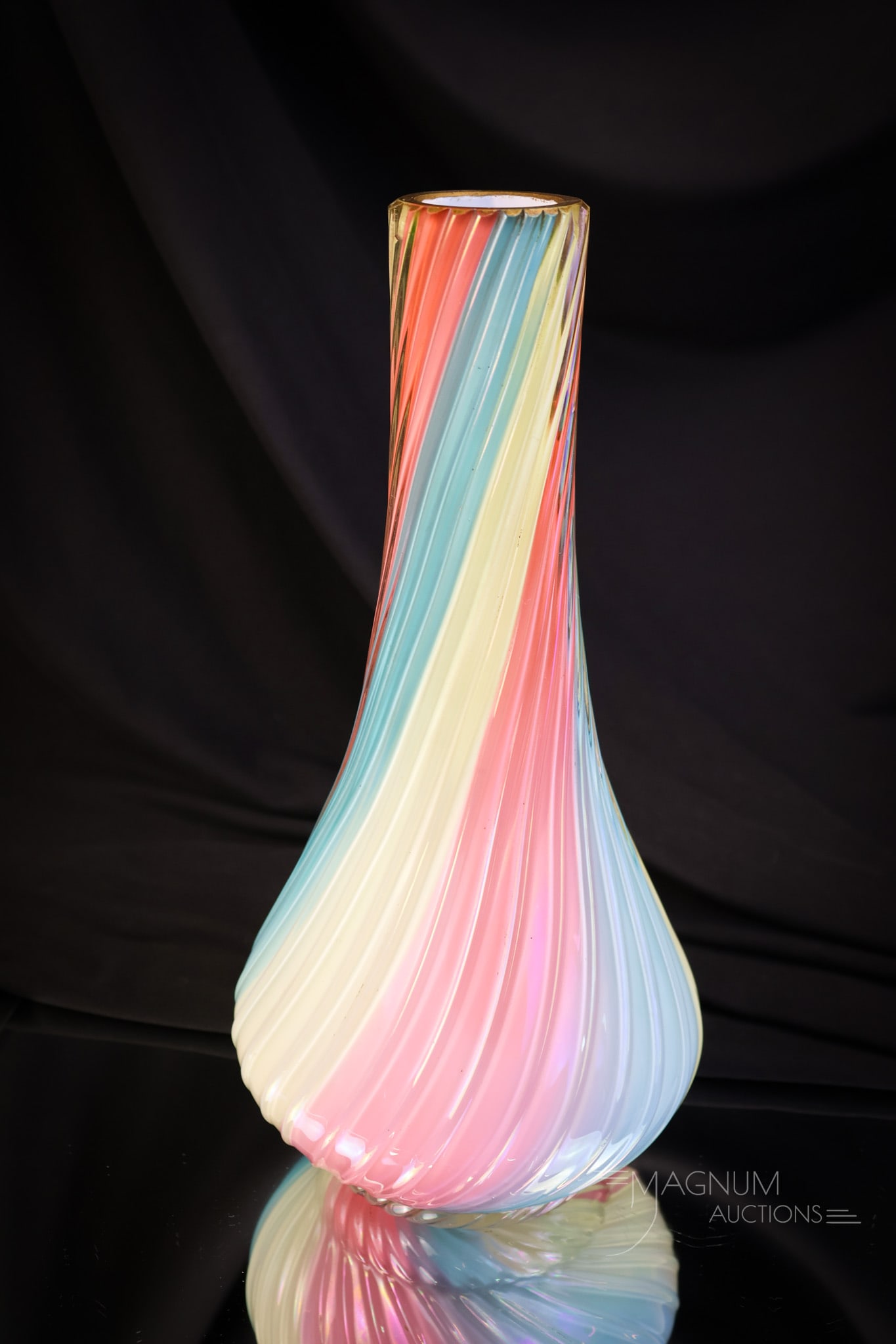 Loetz Rainbow Victorian Rainbow Uranium Art Glass Vase: A fine Loetz rainbow art glass vase. This vcase is in a tapered form. The piece is rich in uranium content and glows brightly under black light. The vase measures 10" tall. SHIPPING NOTICE: If you cho