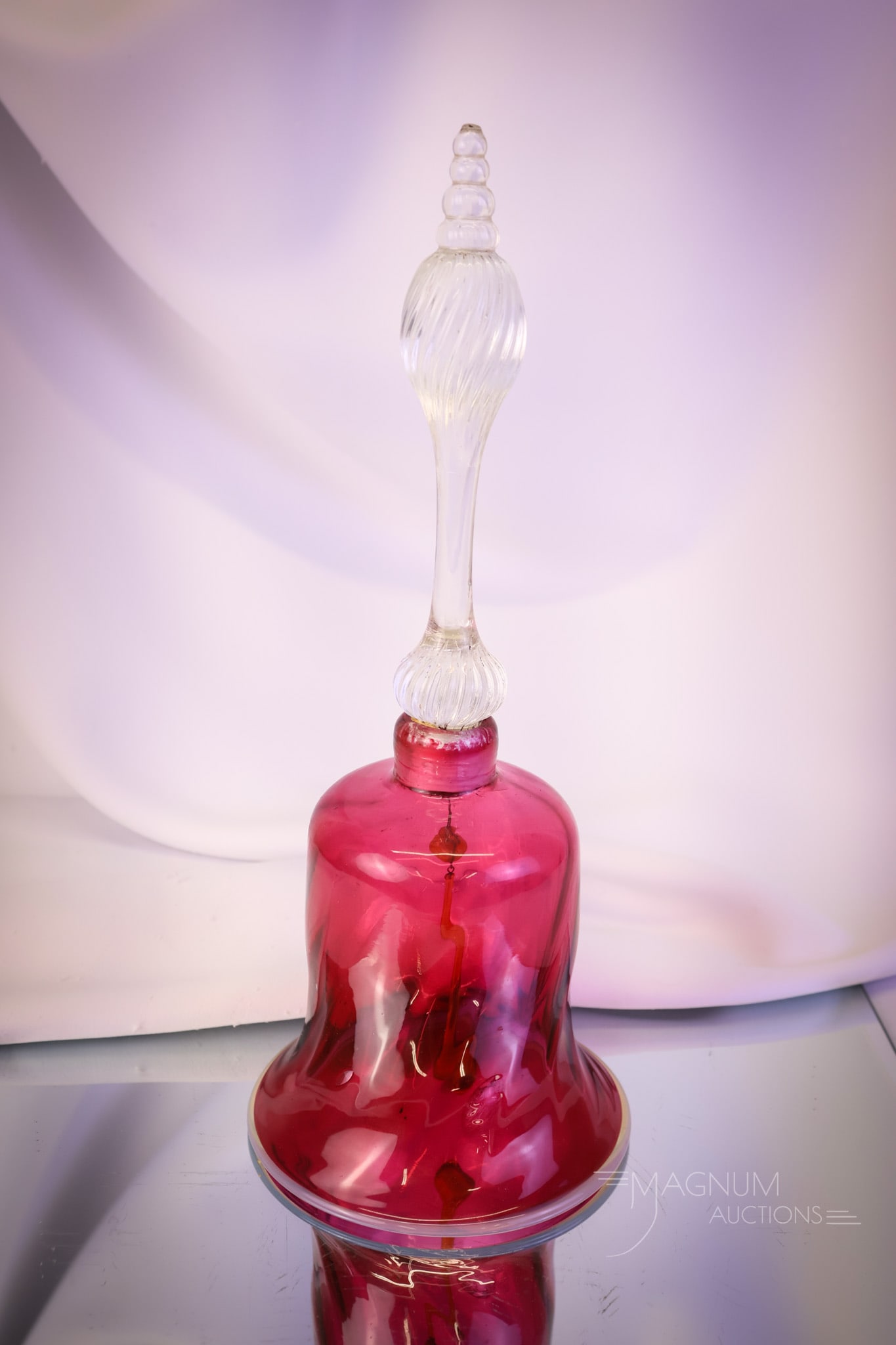 Victorian 12" Cranberry Uranium Glass Wedding Bell: A nice find in a cranberry and uranium glass Victorian wedding bell. This piece measures 12" tall and 5" wide. The rim has an applied glass edge that is rich in uranium content. SHIPPING NOTICE: If yo