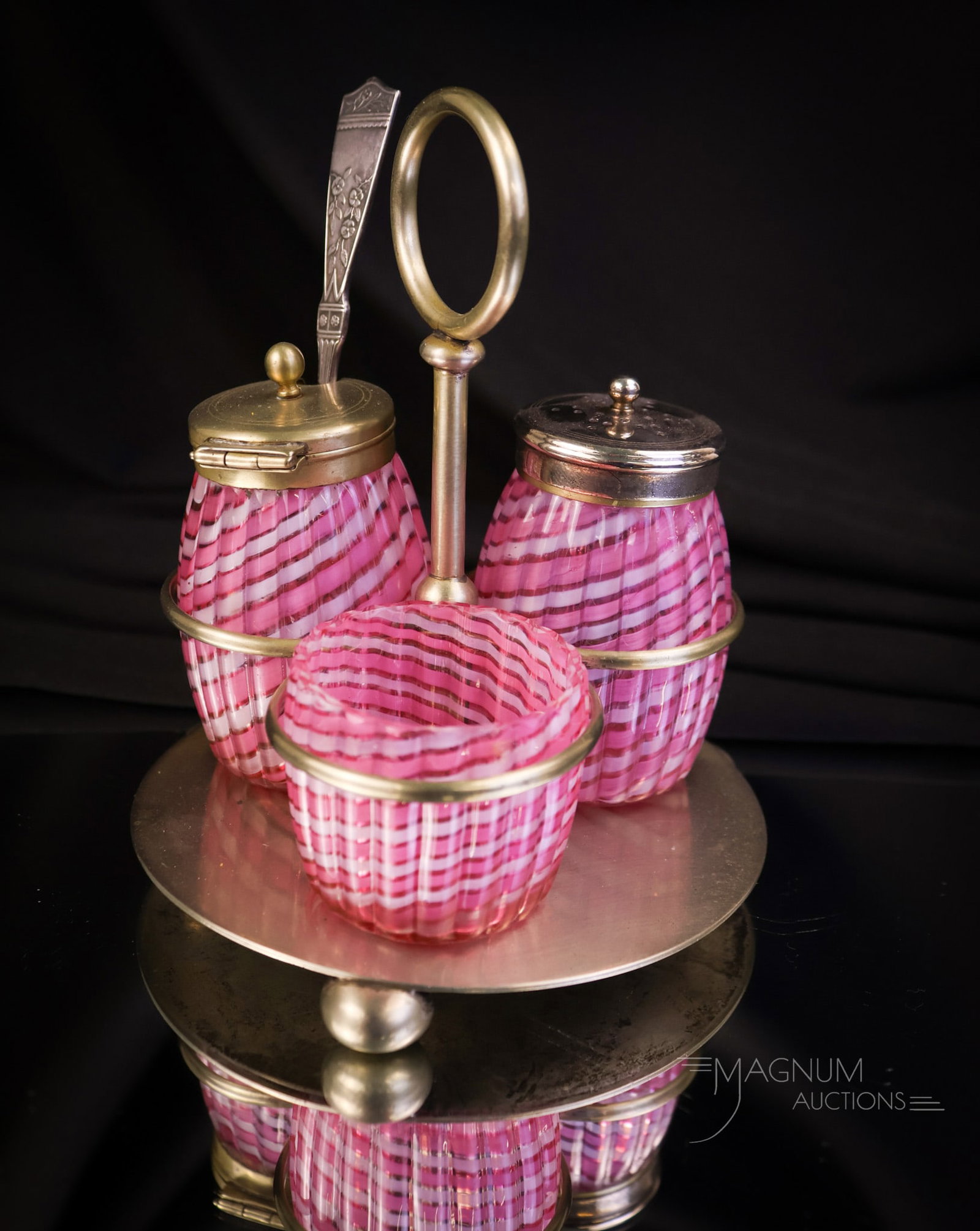Rare Stevens & Williams Victorian Ribbon Swirl Salt Shaker Condiment Set: This rare set is attributed to Stevens & Williams. The set is in a pink and white ribbon swirl glass. The condiment set features a mustard, a pepper shaker, and an open salt. The set is complete in th