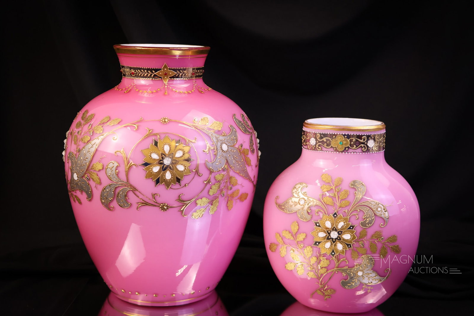 2 Harrach Peachblow Cabochon Jeweled Gilt Enameled Victorian Glass Vases: This lot is a Mother Magnum Favorite. This offering includes two attributed to Harrach peachblow cased glass vases. One is larger than the other. Each is expertly decorated with lots of gold and ename