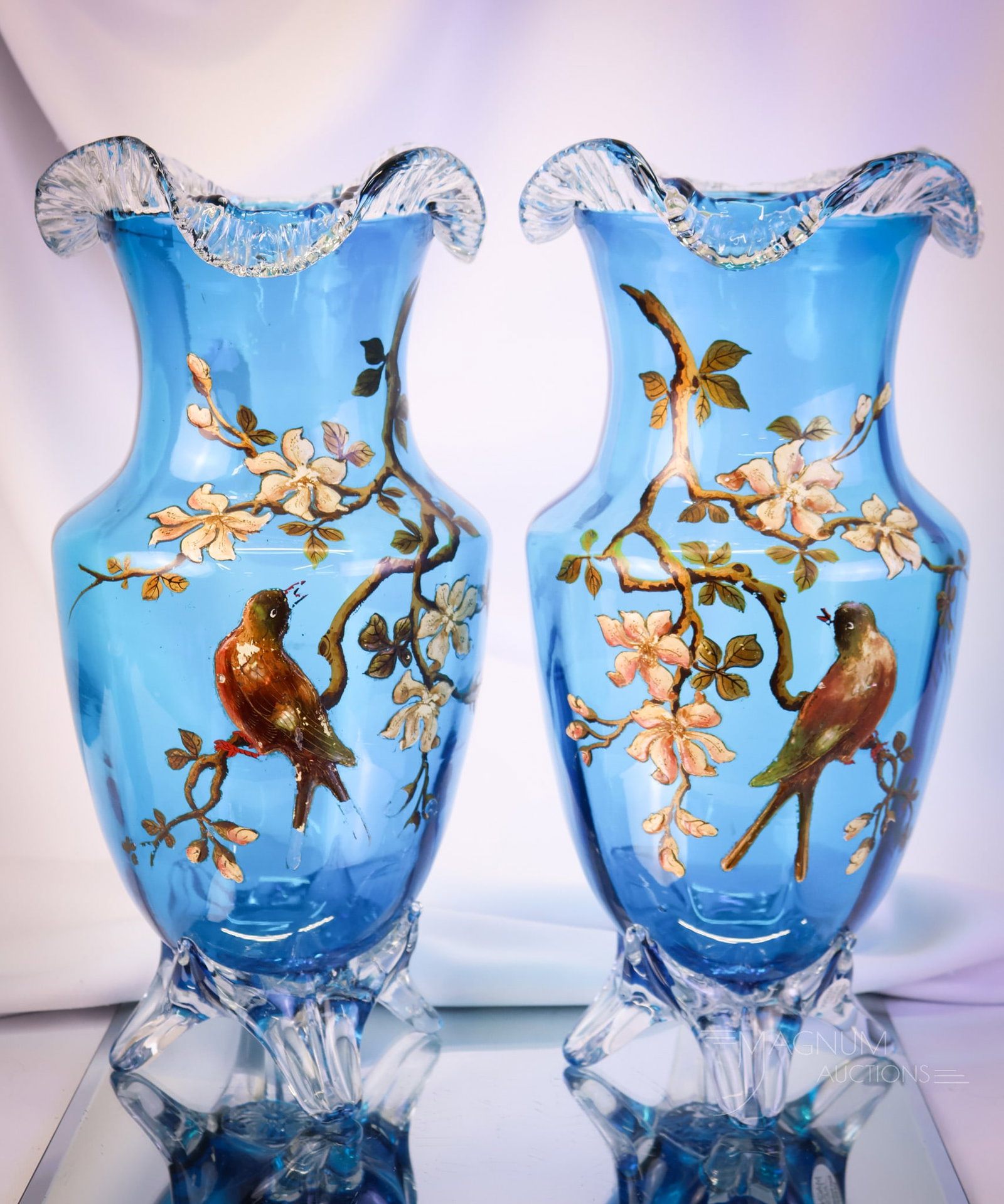Monumental 14 1/4" Bohemian Applied & Enameled Glass Victorian Mantle Vases: A truly monumental find in a Victorian pair of mantle vases. This pair is in Azure blue with applied clear glass feet and rims. Each features an enameled bird on a branch. Each vase measures 14 1/4" t