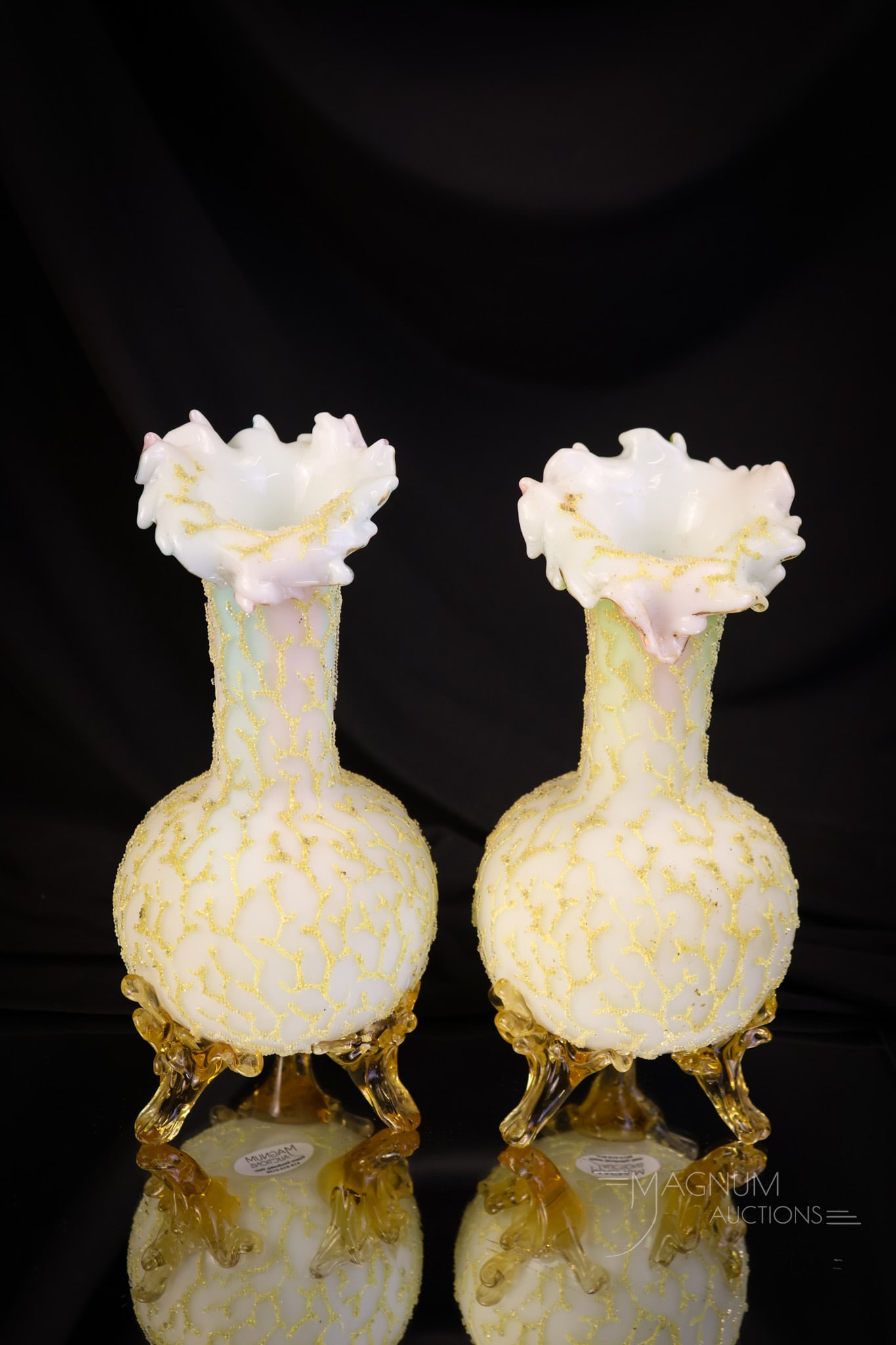 Pair of Victorian Rainbow Finger Top Art Glass Coralene Vases: Pair of Victorian finger-top rim vases in rainbow satin glass with yellow seaweed coralene decoration. Each vase measures 7 1/2" tall and 3 1/2" wide. One vase exhibits a chip to the tip of one foot. 