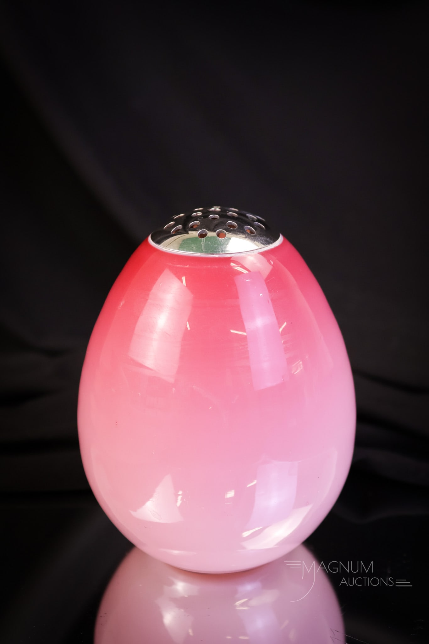 Rare Glossy Peachblow Glass Ostrich Egg Sugar Shaker: A rare find in an art glass sugar shaker. This one is in glossy peachblow cased glass. This shaker has perfect graduated coloring and a silverplate pronged top. Are you lucky enough to own one? This s