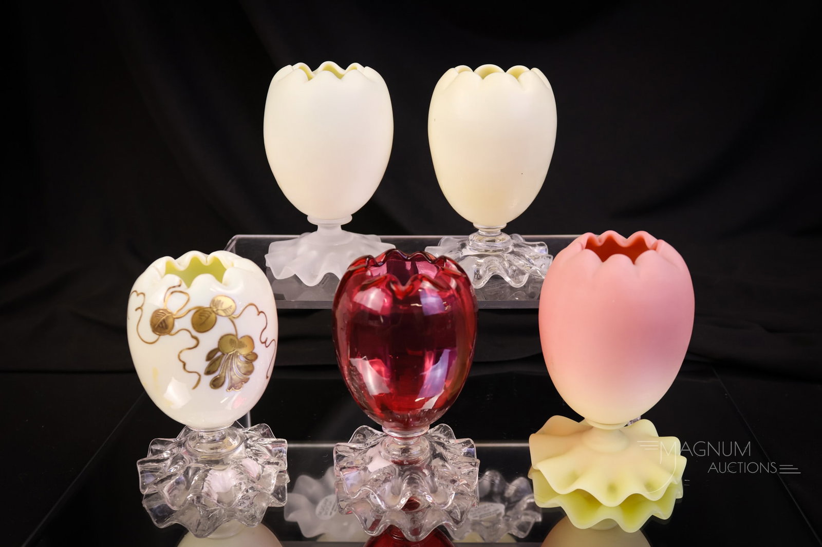 5 pc Lot Webb Victorian Art Glass Uranium Custard Burmese & Cranberry Footed Posy vases: A generous lot of five Webb footed posy vases in an array of color ways. Each measures 3 1/2" tall and 2 1/2" wide. There is a custard with a satin foot. A custard with gloss foot. A custard with enam