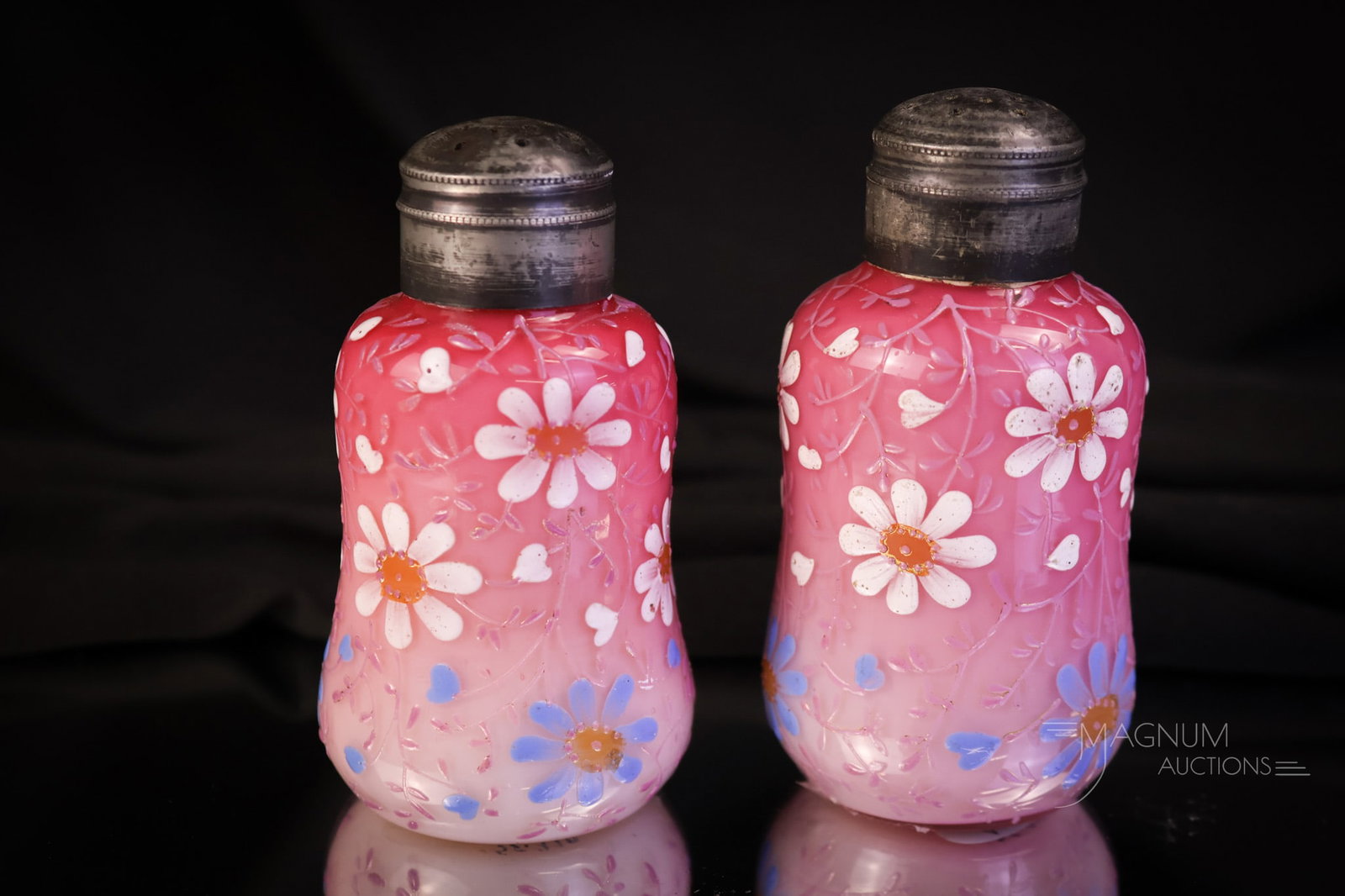 Rare Pair of Victorian Peachblow Queen Anne Salt Shakers: A rare find in a pair of Victorian salt shakers. This pair is in peachblow with Queen Anne decoration. Each with lovely shaded coloring and beautiful enamel work. This pair measures 3 1/4" tall and 2"