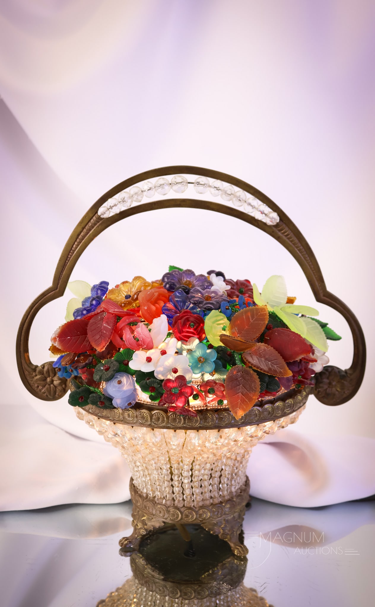 Czech 11" Uranium Glass Flower Assortment Basket Lamp: This Czech art glass lamp measures 11" tall and 10" wide. It is loaded with a bounty of rich, colorful blossoms and includes clusters of uranium glass foliage. The basket is made of faceted crystals, 