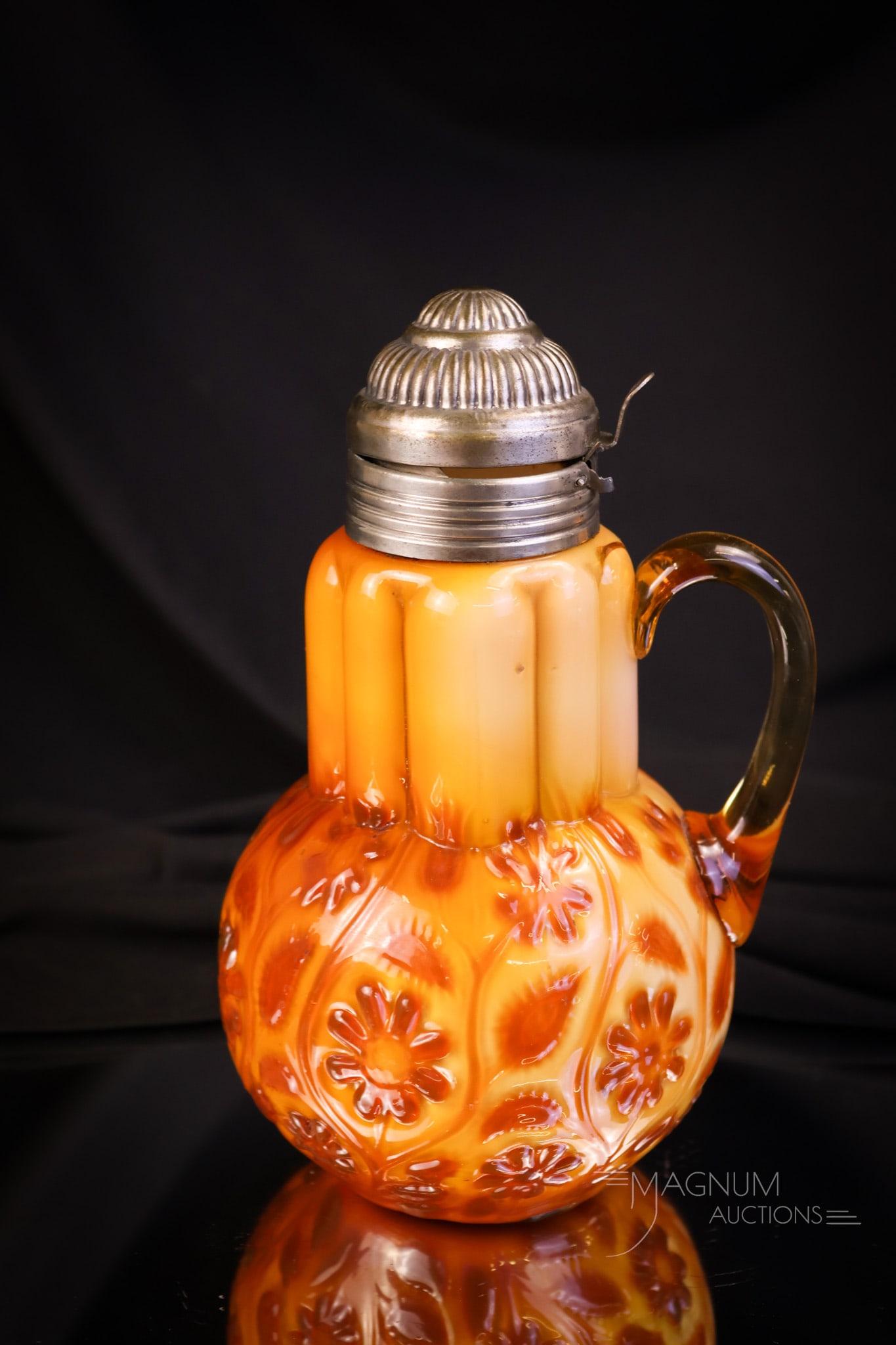 Museum Rarity Harvest Orange Findlay Onyx Glass Syrup Pitcher: Folks, this piece is truly a museum rarity. This syrup has absolutely extraordinary coloring. It is a harvest orange. The color is intense! This syrup measures 7" tall and 4 1/2" wide. There is a shor