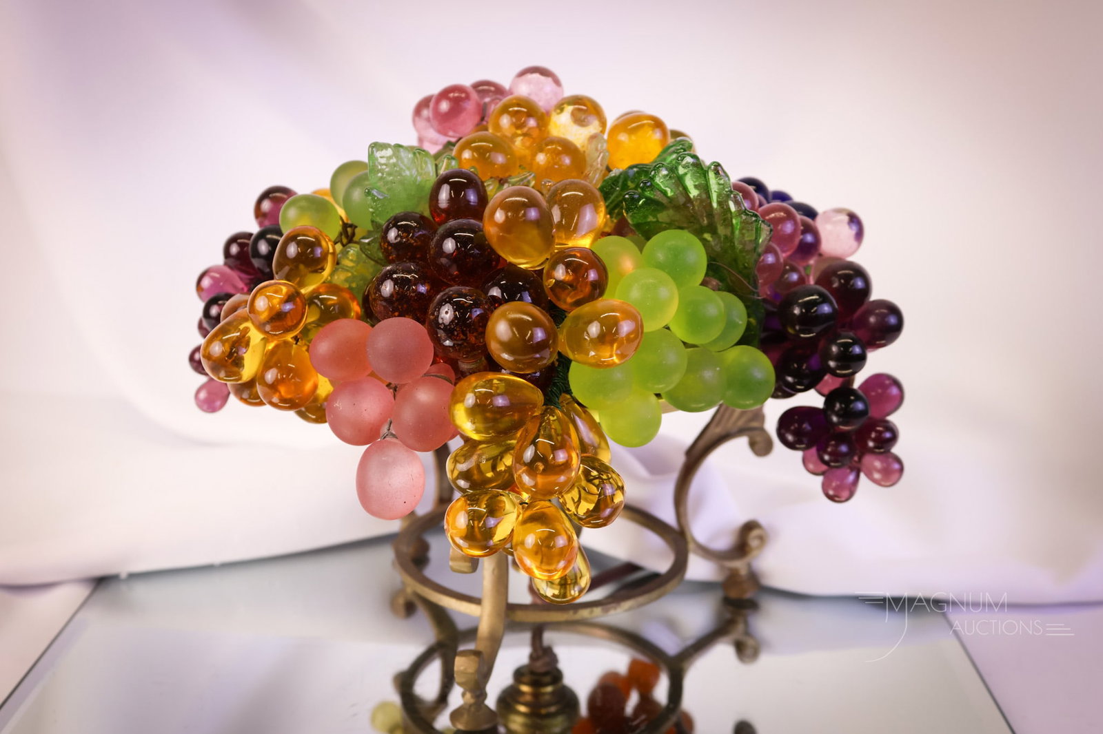 Art Deco Czechoslovakia Glass Fruit Lamp: A beautiful find in an Art Deco period Czech glass fruit lamp. This lamp has a three-legged base. The glass fruit portion has a bounty of colorful grapes and foliage in various colors of glass. The la