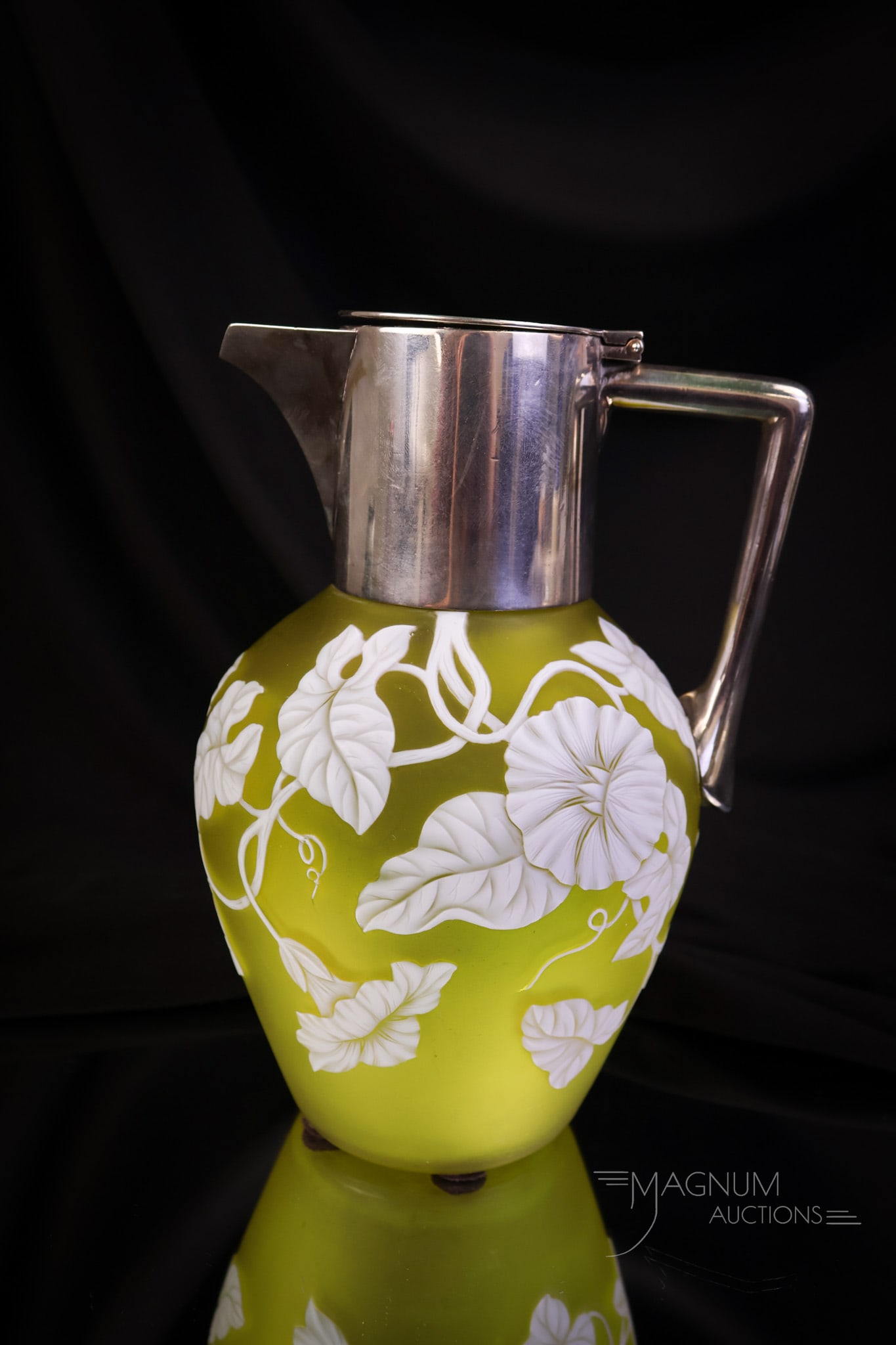 Victorian Webb Citron Cameo Glass English Hallmark Silverplate Pitcher: A fine piece of Victorian Webb cameo glass with English silverplate hallmarked mountings. This pitcher is decorated with morning glory flowers and foliage. The piece measures 8" tall and 5" wide. SHIP