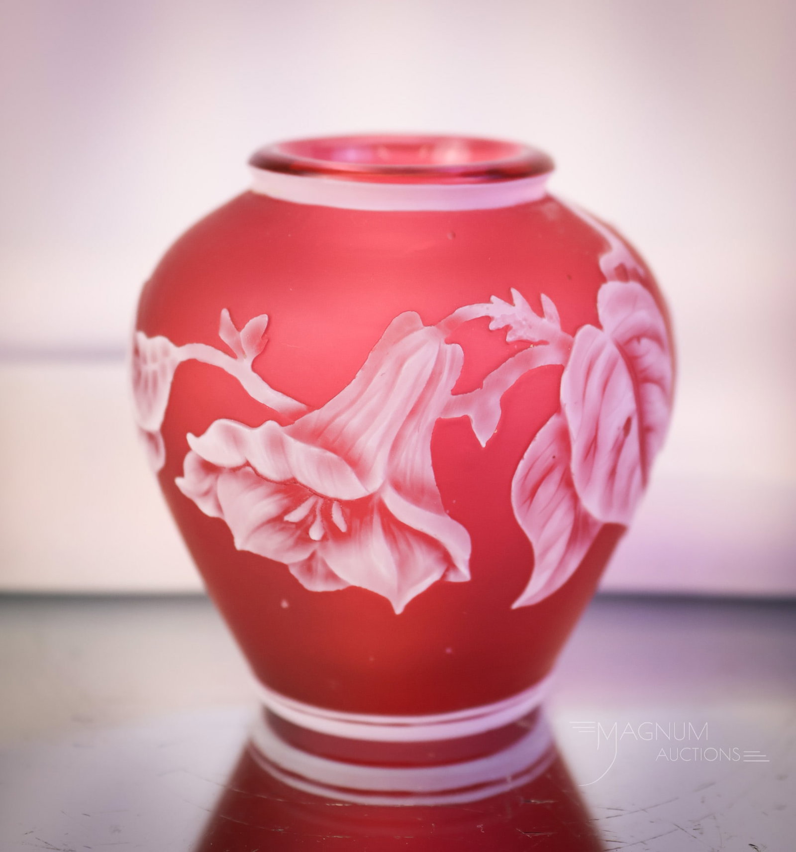 2" Miniature Cranberry Victorian English Cameo Art Glass Vase: A sweet little find in English Victorian cameo art glass. This is a cabinet vase in cranberry. The vase has a floral design of a honeysuckle flower. This little gem measures 2" tall and 2 1/4" wide. S