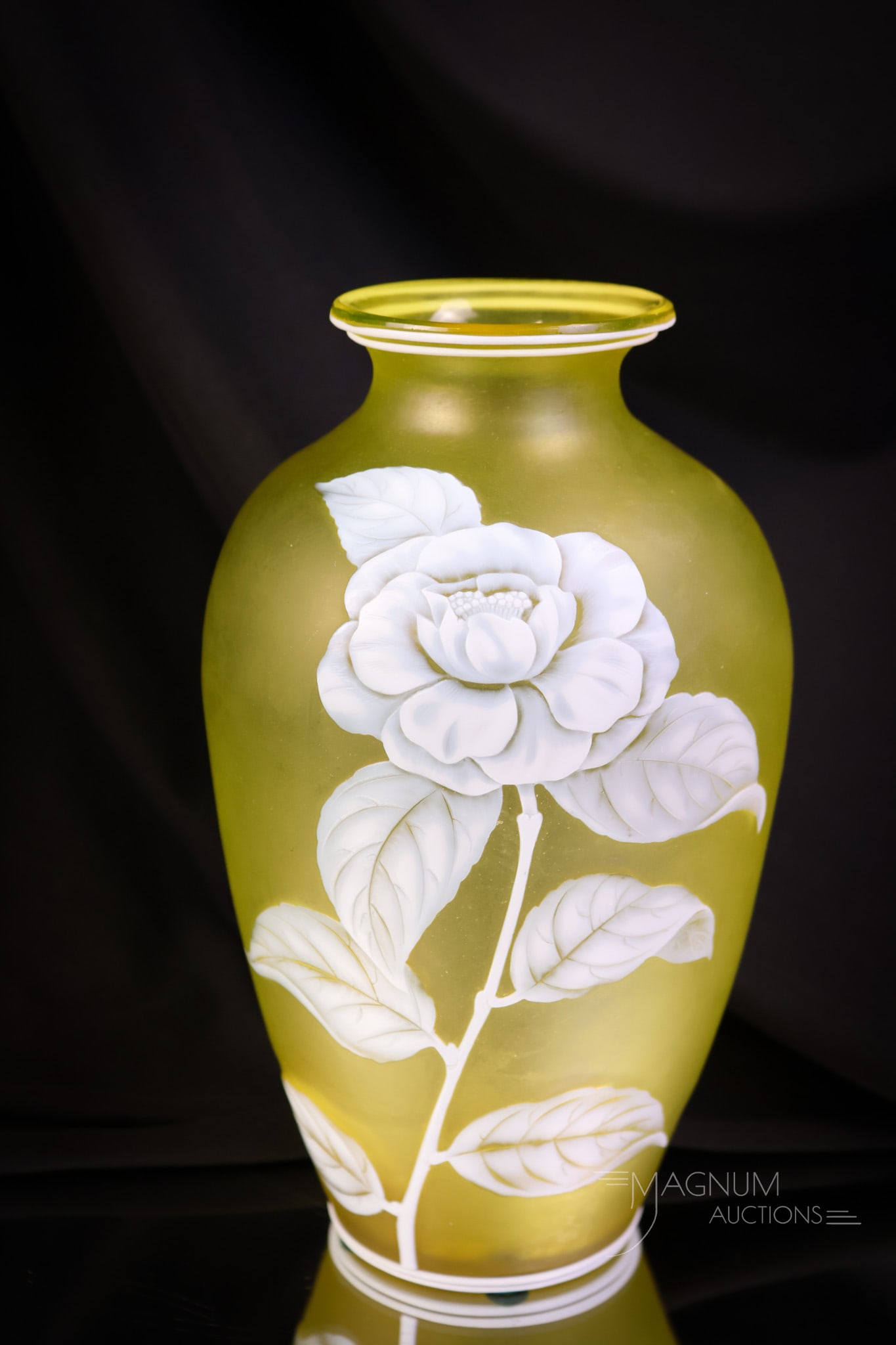 Victorian English Citron Uranium Cameo Art Glass Camelia Flower Vase: A Victorian English cameo glass vase. This vase is in white cut to citron. This vase features a camelia flower for decoration. The piece is rich in uranium and glows brightly under black light. This l
