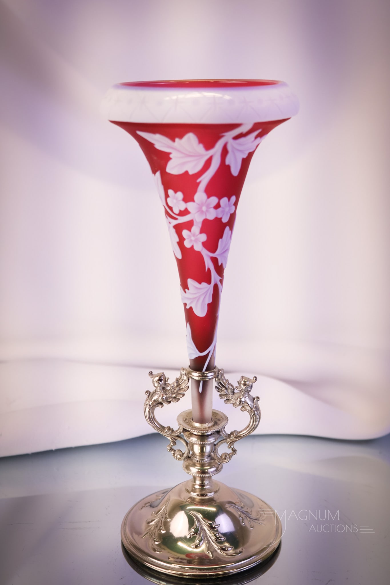 Victorian English Cameo Cranberry & White Art Glass & Silverplate Lily Vase: A seldom found form in English cameo art glass. This is a lily vase in cranberry and white English cameo. The vase features a design of leaves and flowers and a star & punty cutting on the rim. The va