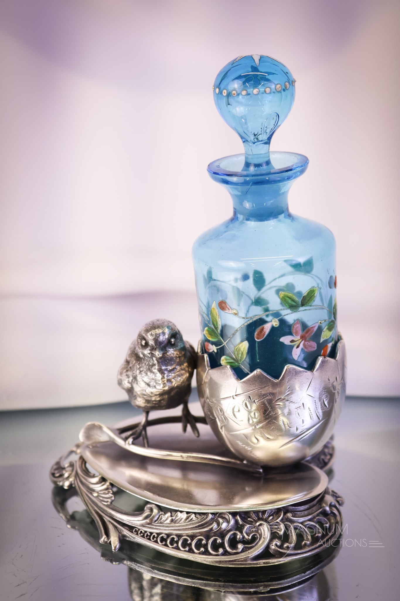 Victorian Figural Silverplate Chick Heart Cracked Egg Enameled Glass Perfume Bottle Castor: A wonderful find in a figural Victorian silverplate holder and enameled glass perfume bottle. This piece is marked "Ben J. J. Mayo" Silverplate". The goldfer features a heart-shaped base with rococo s