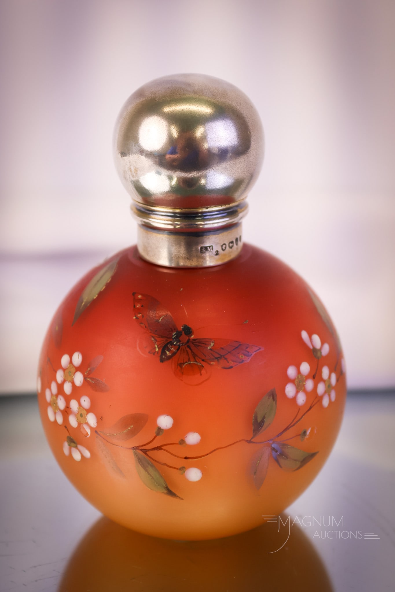 Victorian Peachblow Enamel Decorated Art Glass Hallmarked Sterling Silver Perfume Bottle: A fine piece for your bidding pleasure. This is a Victorian peachblow art glass perfume bottle. This piece has an enamel decoration of flowers and a butterfly. It also has a hallmarked sterling silver