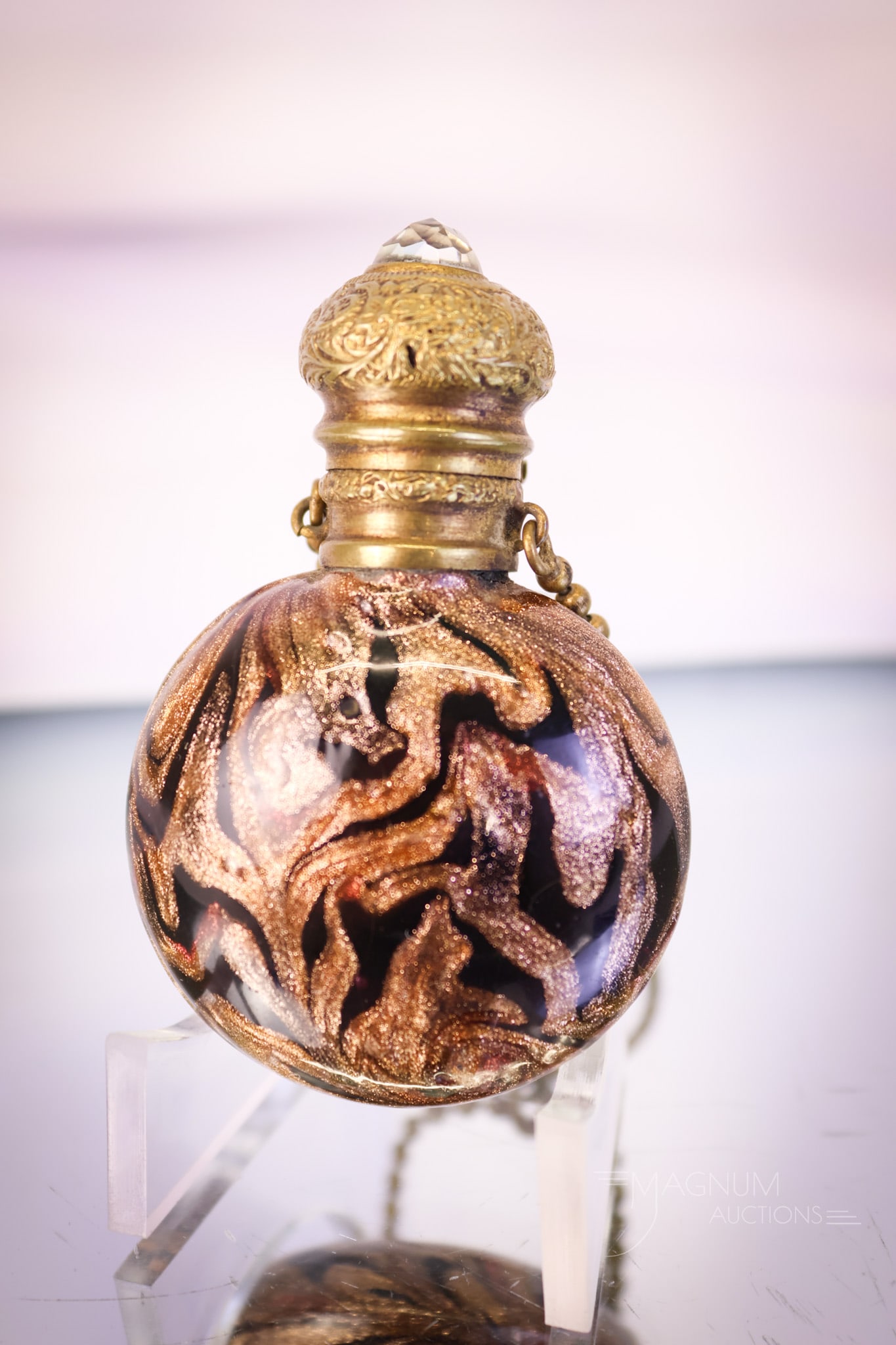 Giovanni Francini Antique Venetian Seahorse Aventurine Glass Perfume Bottle: A beautiful find in a Giovanni Francini antique Venetian perfume bottle. This piece is in aventurine glass in a seaweed pattern with seahorses on black glass. The piece features a ring attachment and 