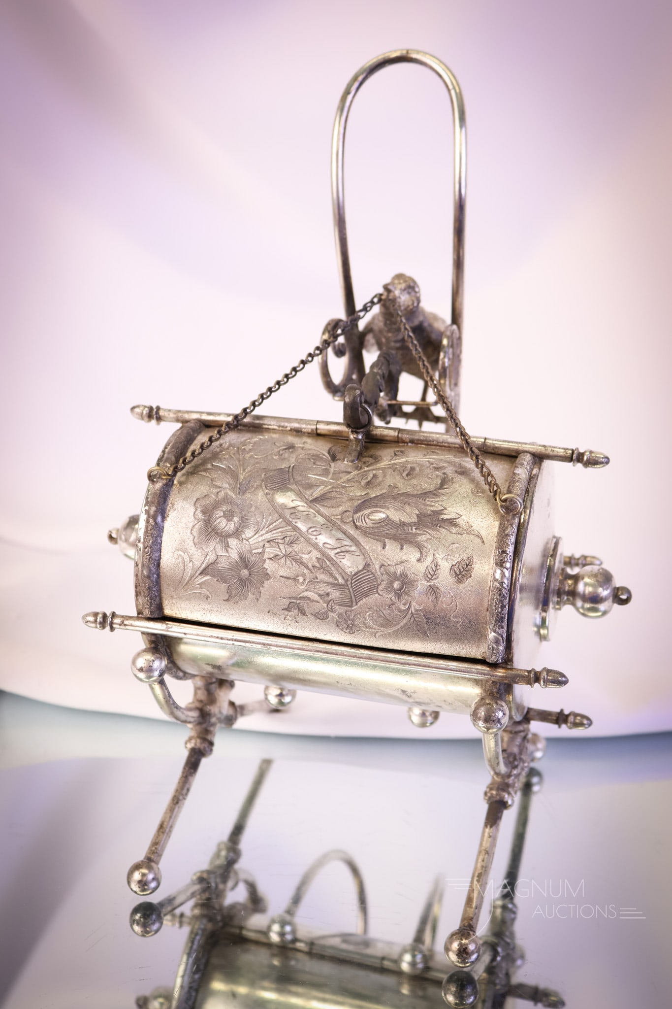 Wilcox Figural Bird Mechanical Silverplate Jewelry Casket: A wonderful piece of Victorian silverplate. This is a marked Webster figural mechanical jewelry casket. This one has a chickadee on the back side with a ring and chain in its beak. The casket is barre